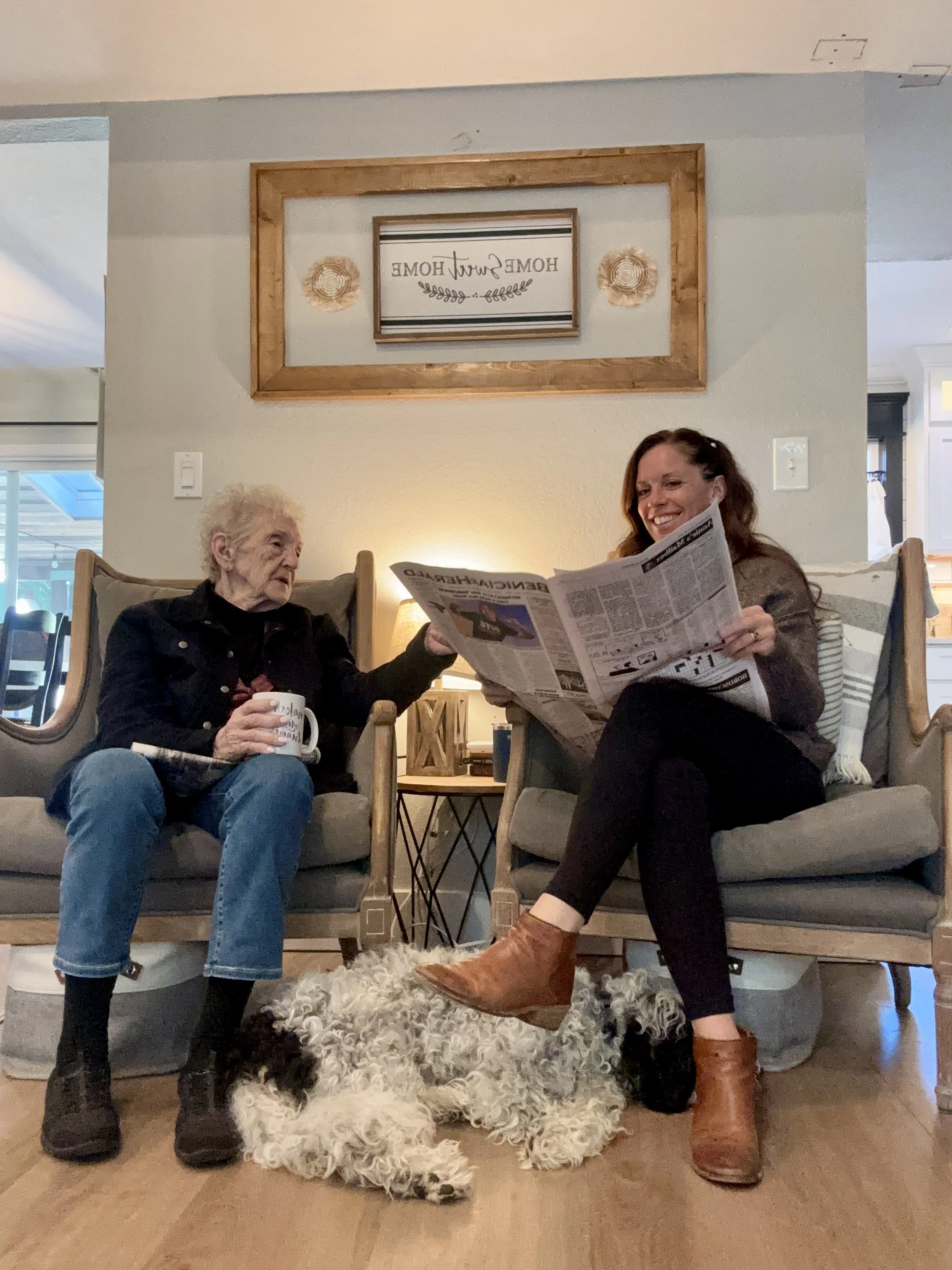 Senior enjoying the morning newspaper at Rebekah’s Retreat adult day care program for seniors with dementia in Fairfield, California.