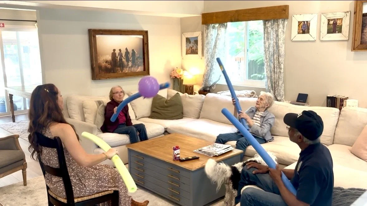 Seniors enjoying pool noodle volleyball and active group fun at Rebekah’s Retreat adult day care program in Fairfield, California.