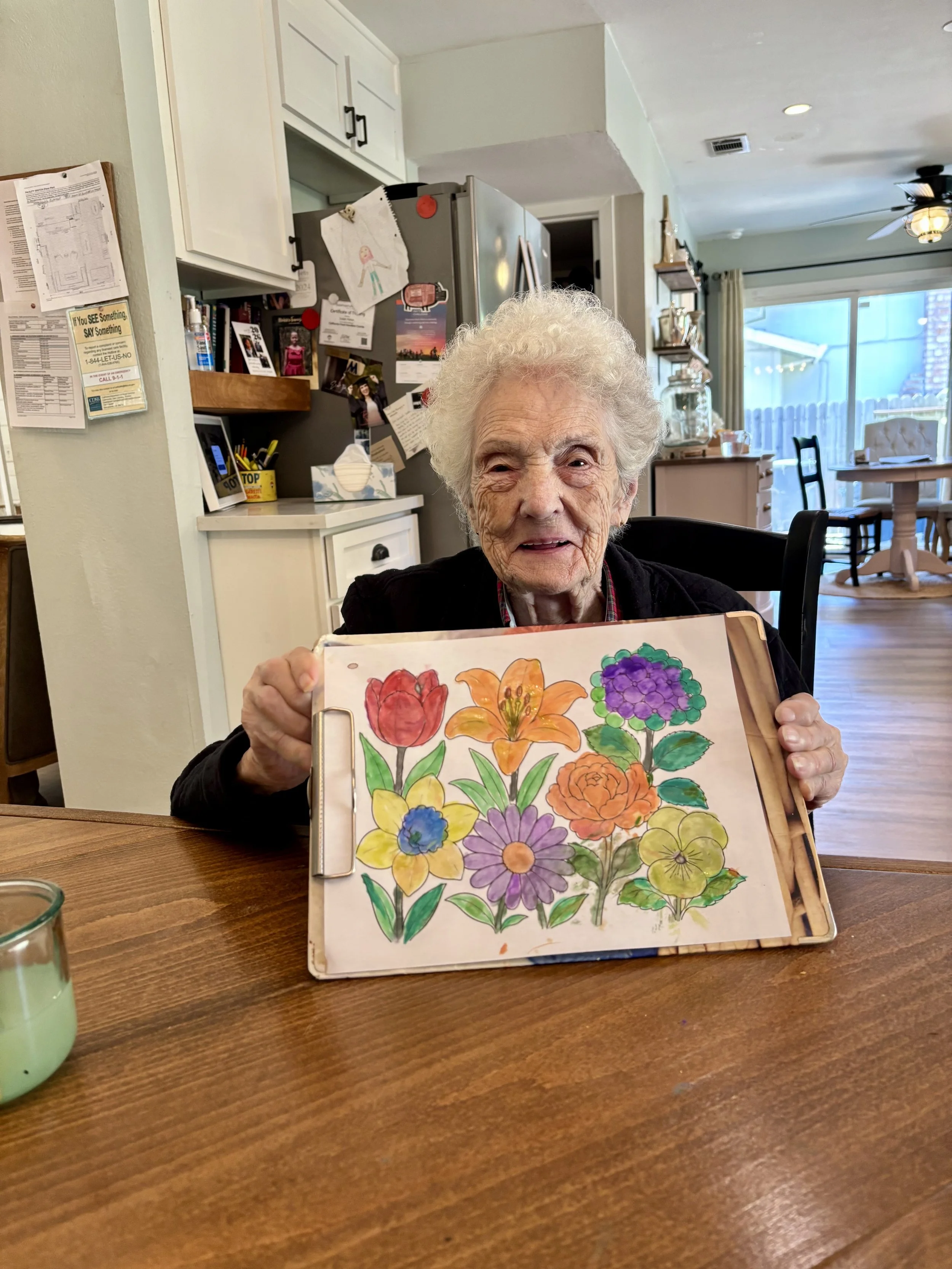 Seniors with memory loss enjoying a creative activity at Rebekah's Retreat.