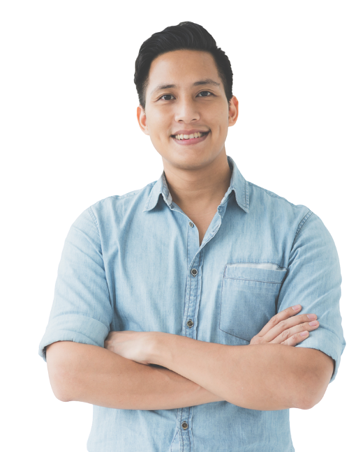 A young man with short dark hair, smiling, wearing a light blue denim button-up shirt, arms crossed.
