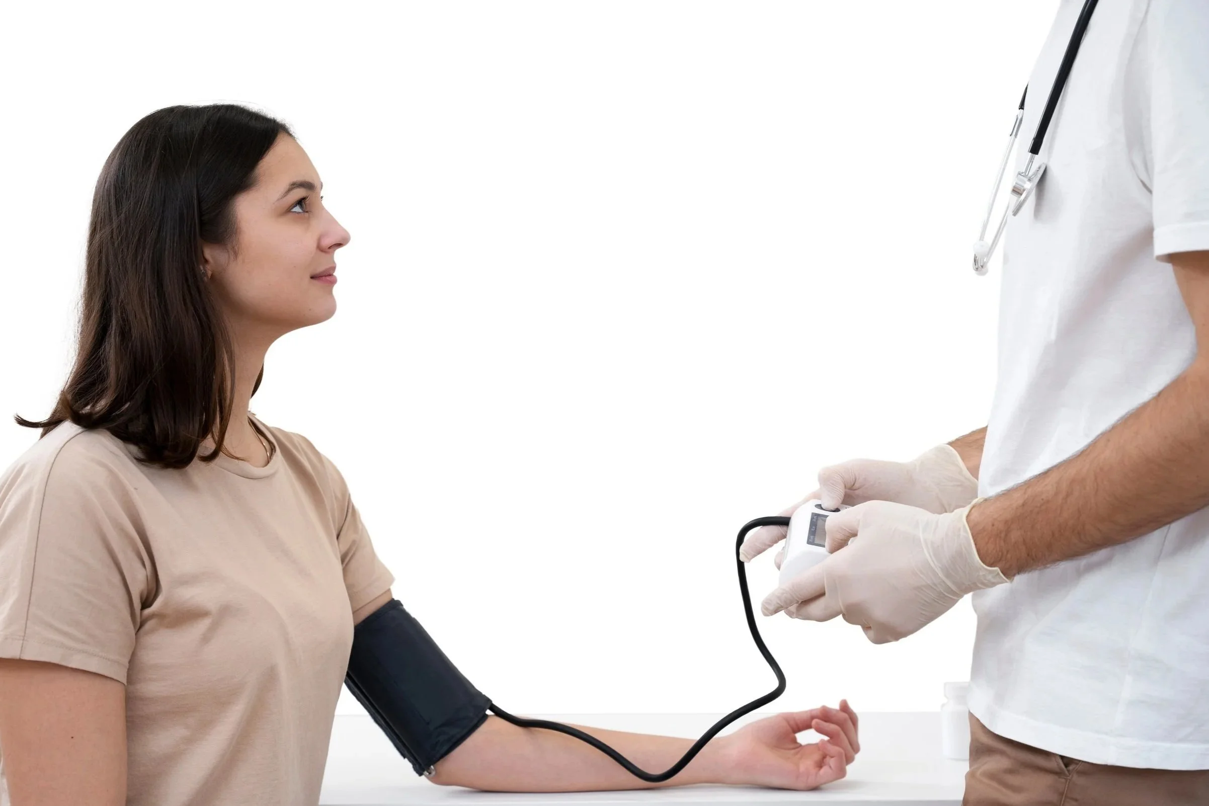 Medical professional measuring woman's blood pressure with a digital cuff. Credits for FreePik