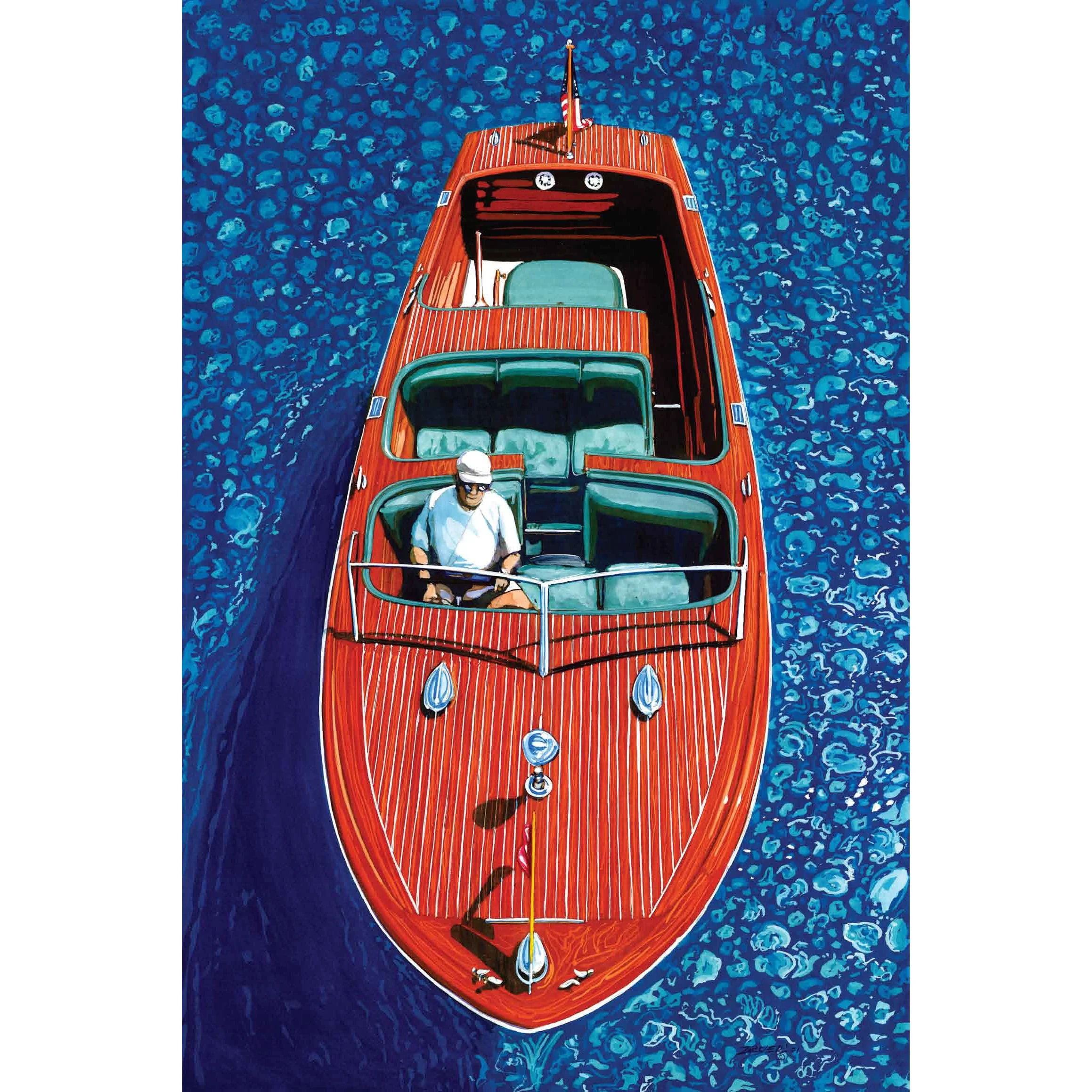 Aerial view of a red yacht cruising on blue ocean waters with a person wearing a white shirt and cap sitting at the bow.
