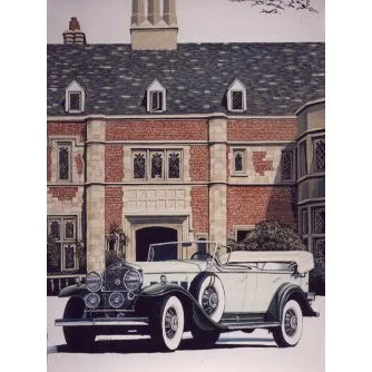 Vintage convertible car parked in front of an old brick building.