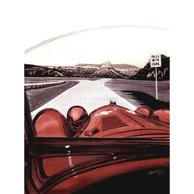 View from inside a racing car on a highway with mountains in the background and a sign that says "Pass with Care".