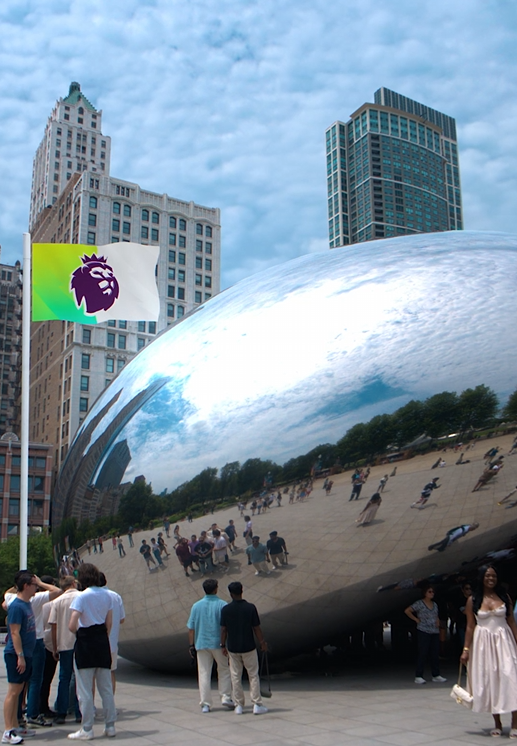 People gather around and look at the large, shiny, reflective Cloud Gate sculpture in Millennium Park, Chicago, with tall buildings and a partly cloudy sky in the background.