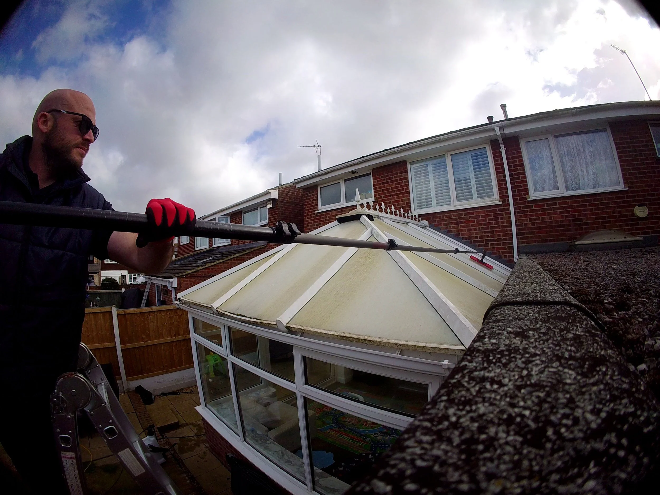 dan cleaning a conservatory roof