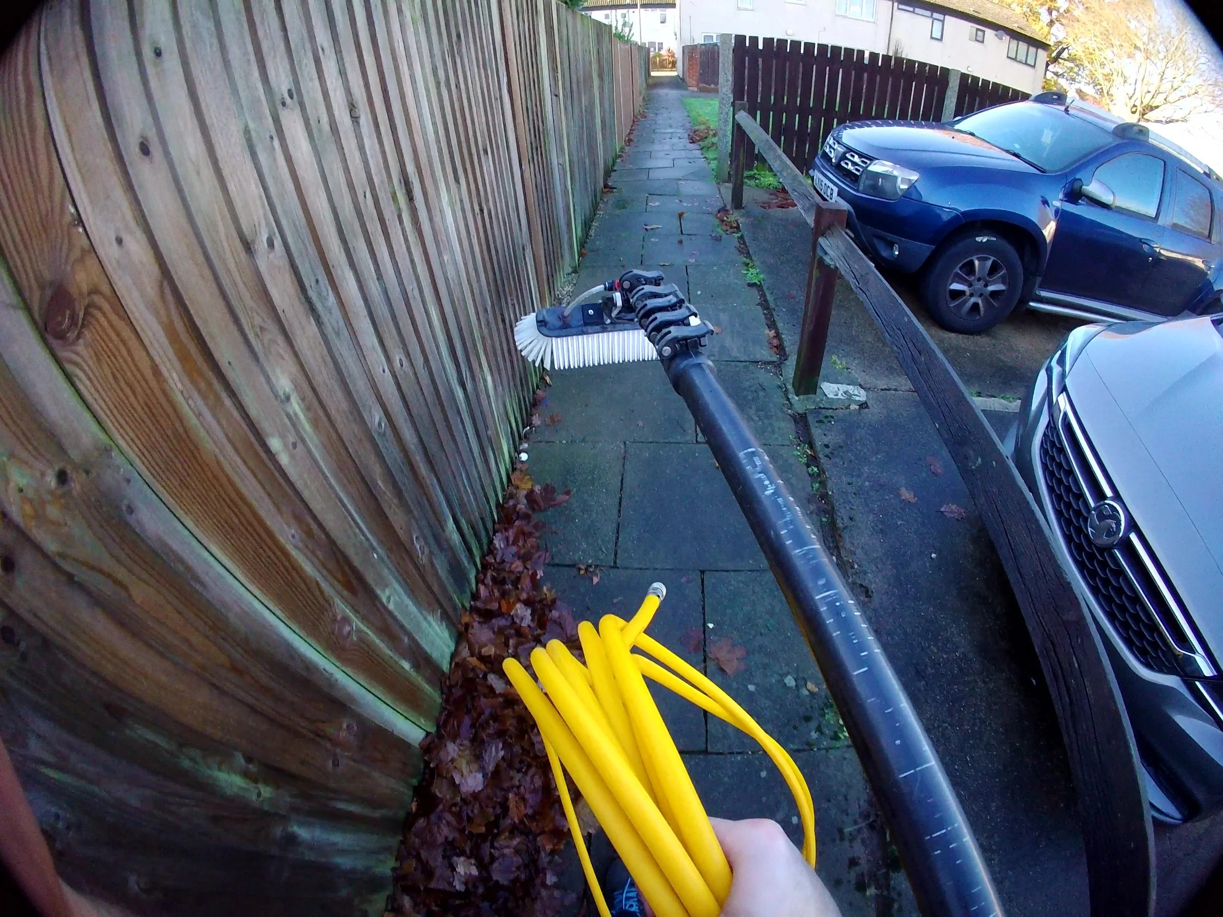 Dan from Sorrell Pressure Wash carrying lightweight window cleaning hose in Colchester Essex.