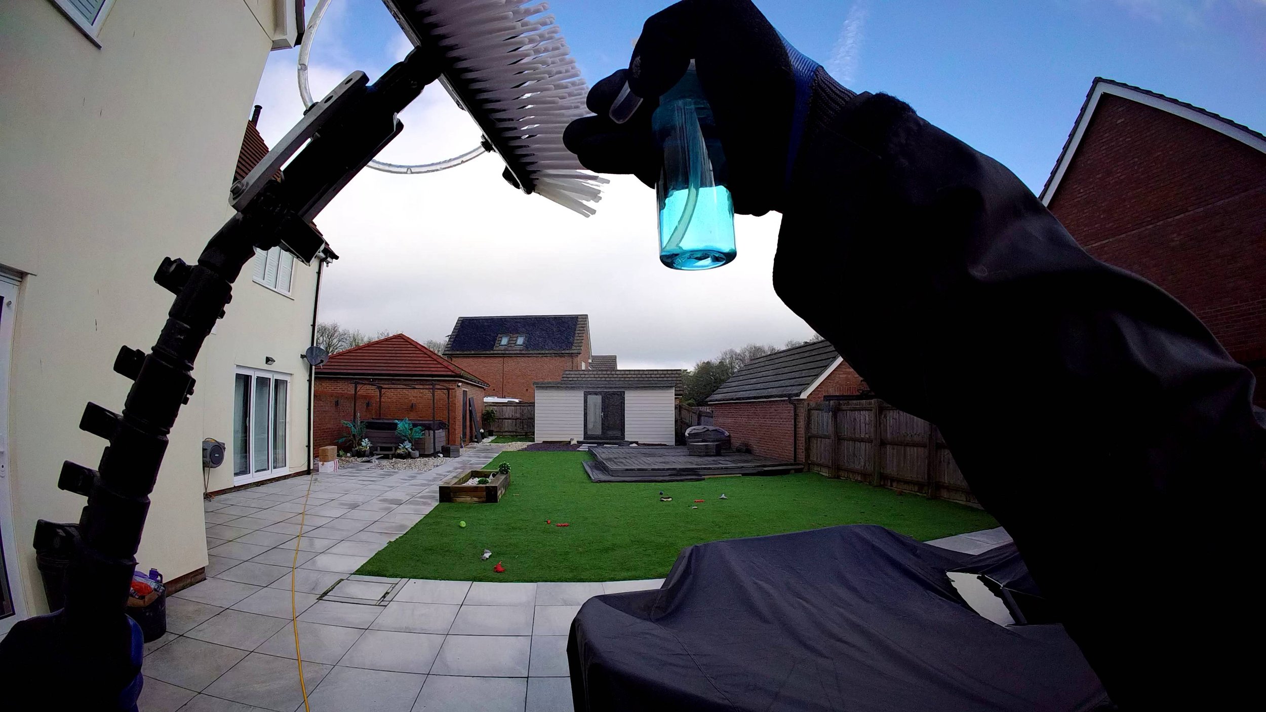 echnician applying specialized cleaning solution directly to brush for precision stain removal.