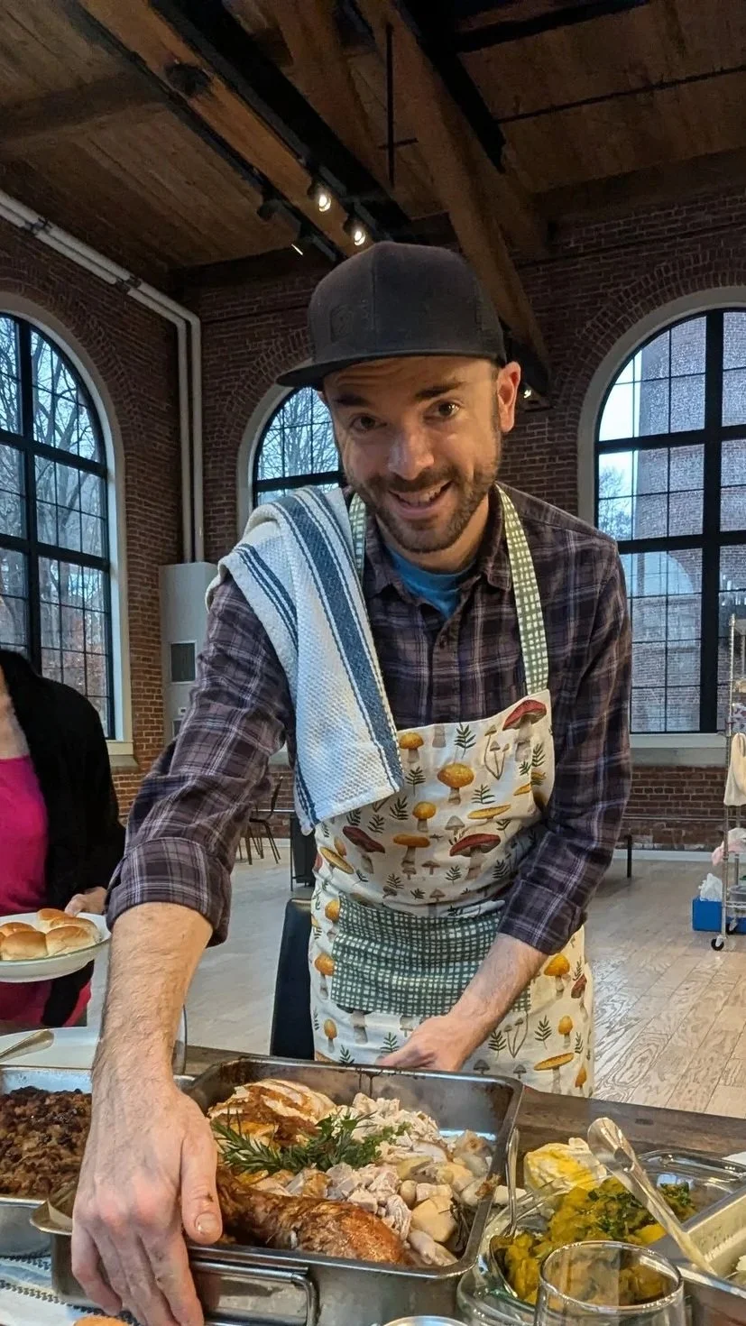 Chef Matthew serving a tray of food at a private dinner