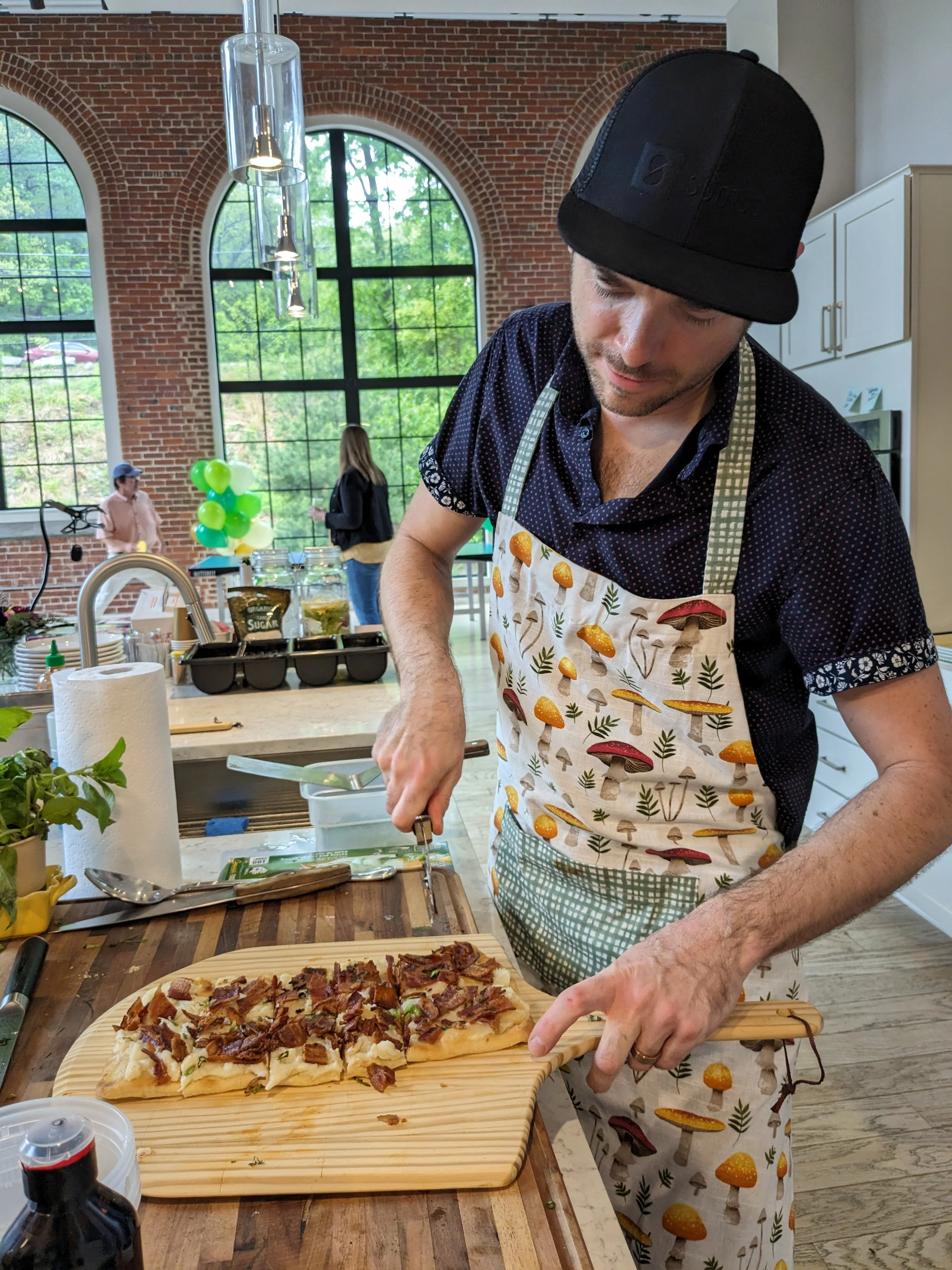 Chef Matthew cutting a flatbread - private dinner MA