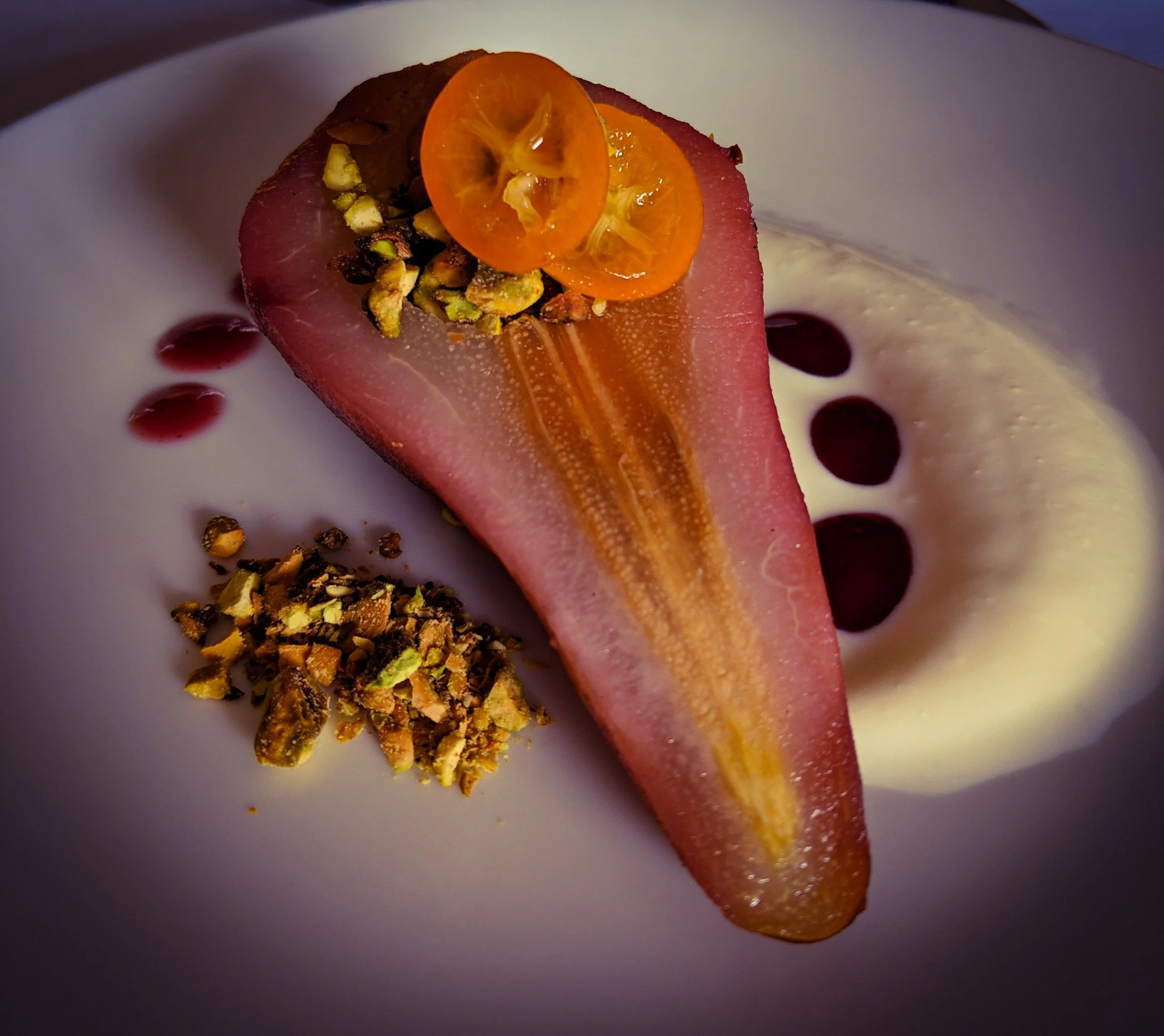 Poire au Beaujolais - Red wine-poached bear with fresh yogurt, candied kumquat, and pistachio