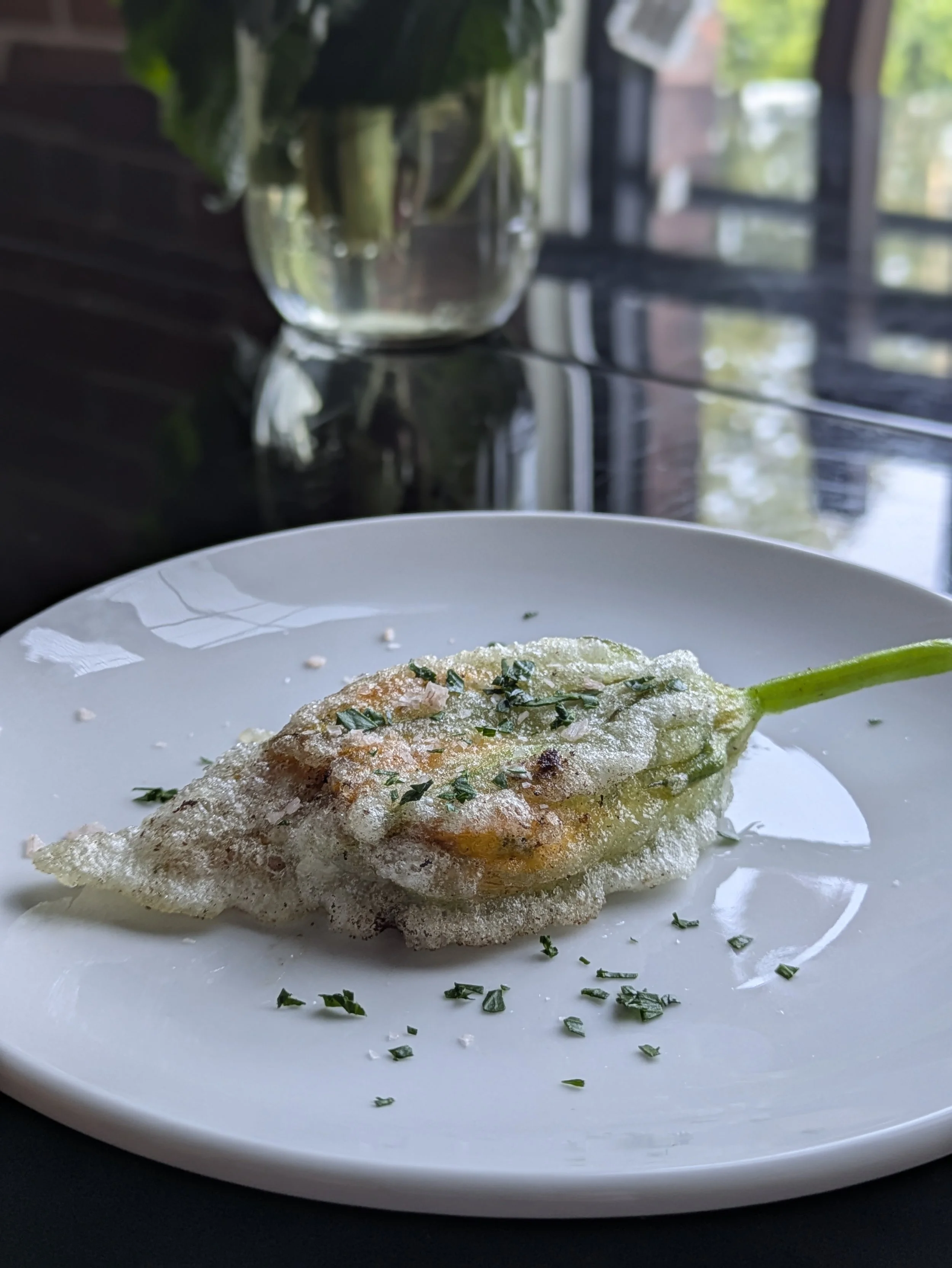 Batter-fried squash blossom stuffed with herbed goat cheese
