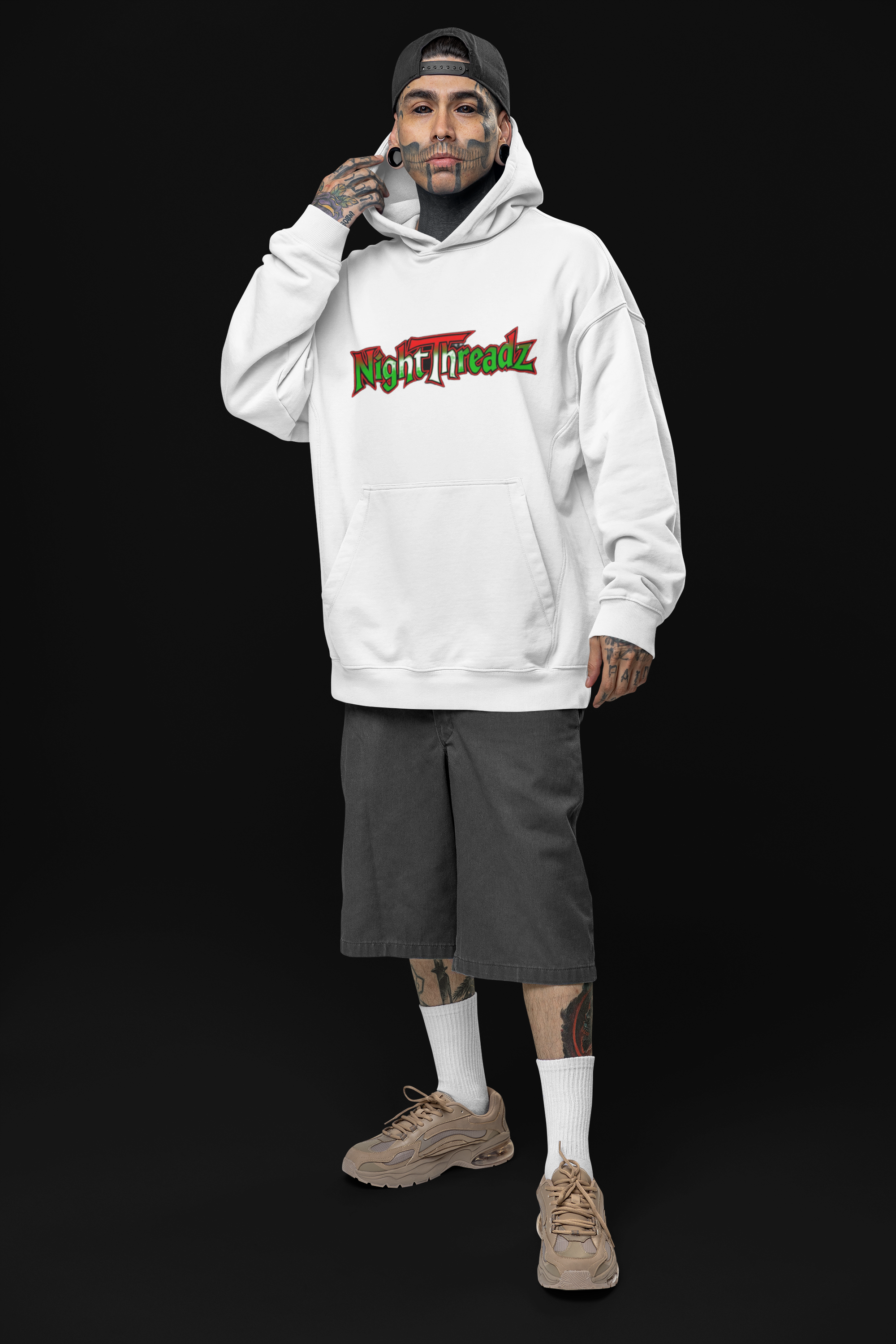 oversized-hoodie-mockup-of-a-tattooed-man-posing-in-a-studio-with-an-alternative-look-m31666 7.png