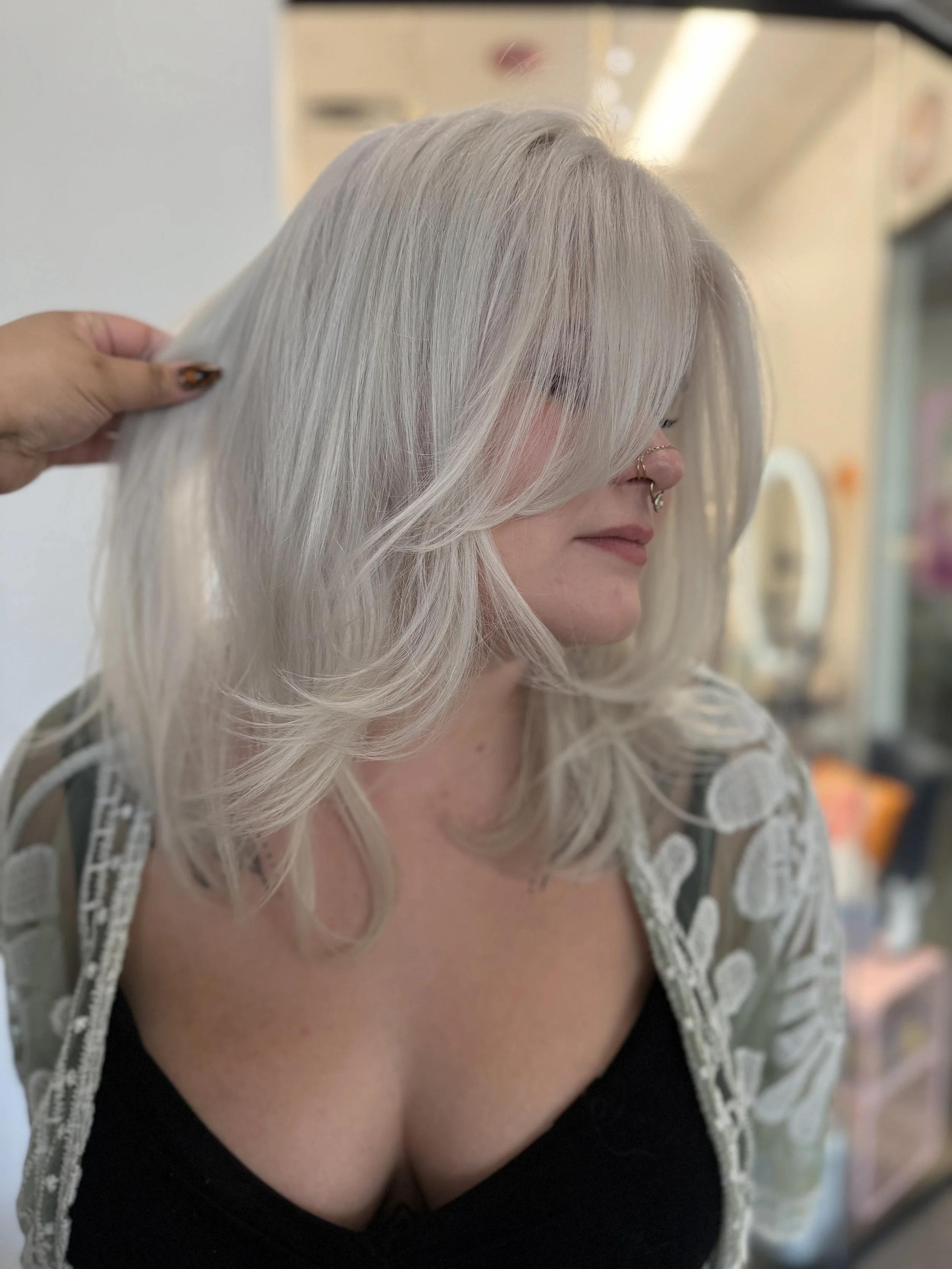 Salon customer with new long natural braids