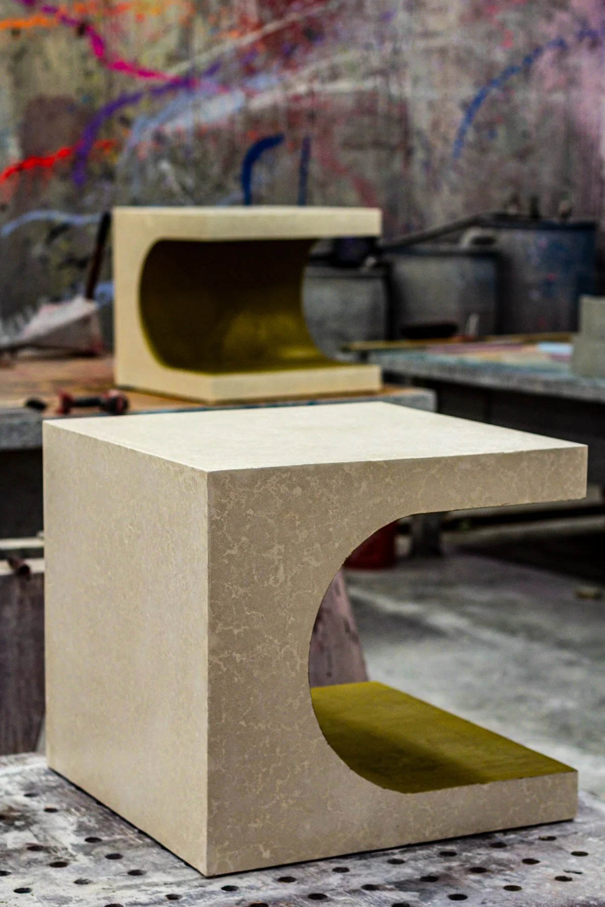 Radius | CUBED concrete side table demonstrating how a fixed geometry can contain multiple evolving material conditions.