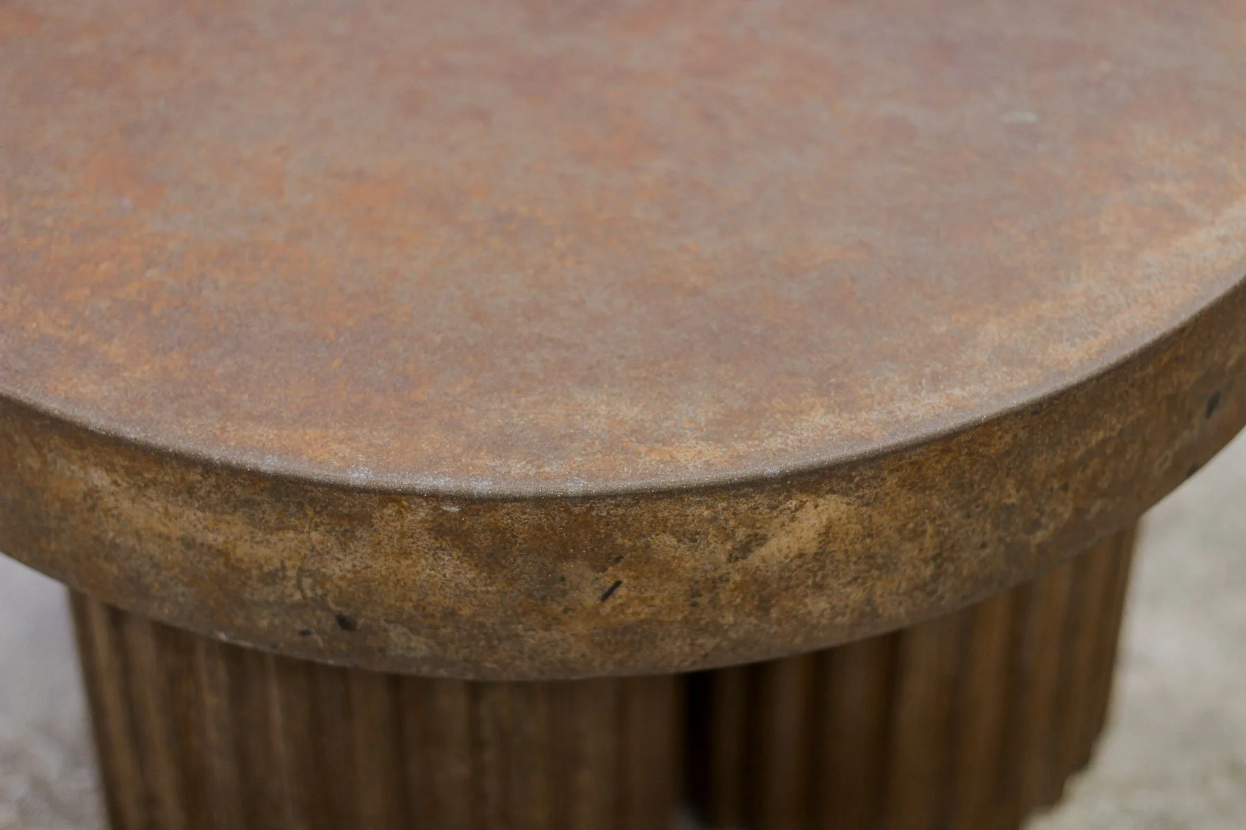 Close-up detail of the hand-finished tobacco mineral patina and monolithic edge condition of FLUTED | TOBACCO.