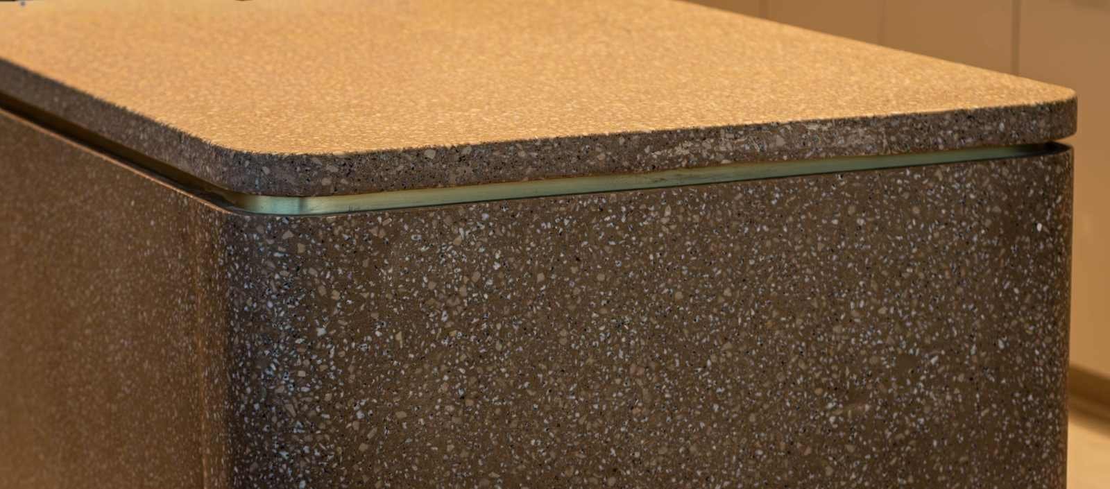 Rounded terrazzo concrete edge detail with integrated brass reveal fabricated for the Glenmede headquarters project associated with Gensler in Philadelphia, Pennsylvania.