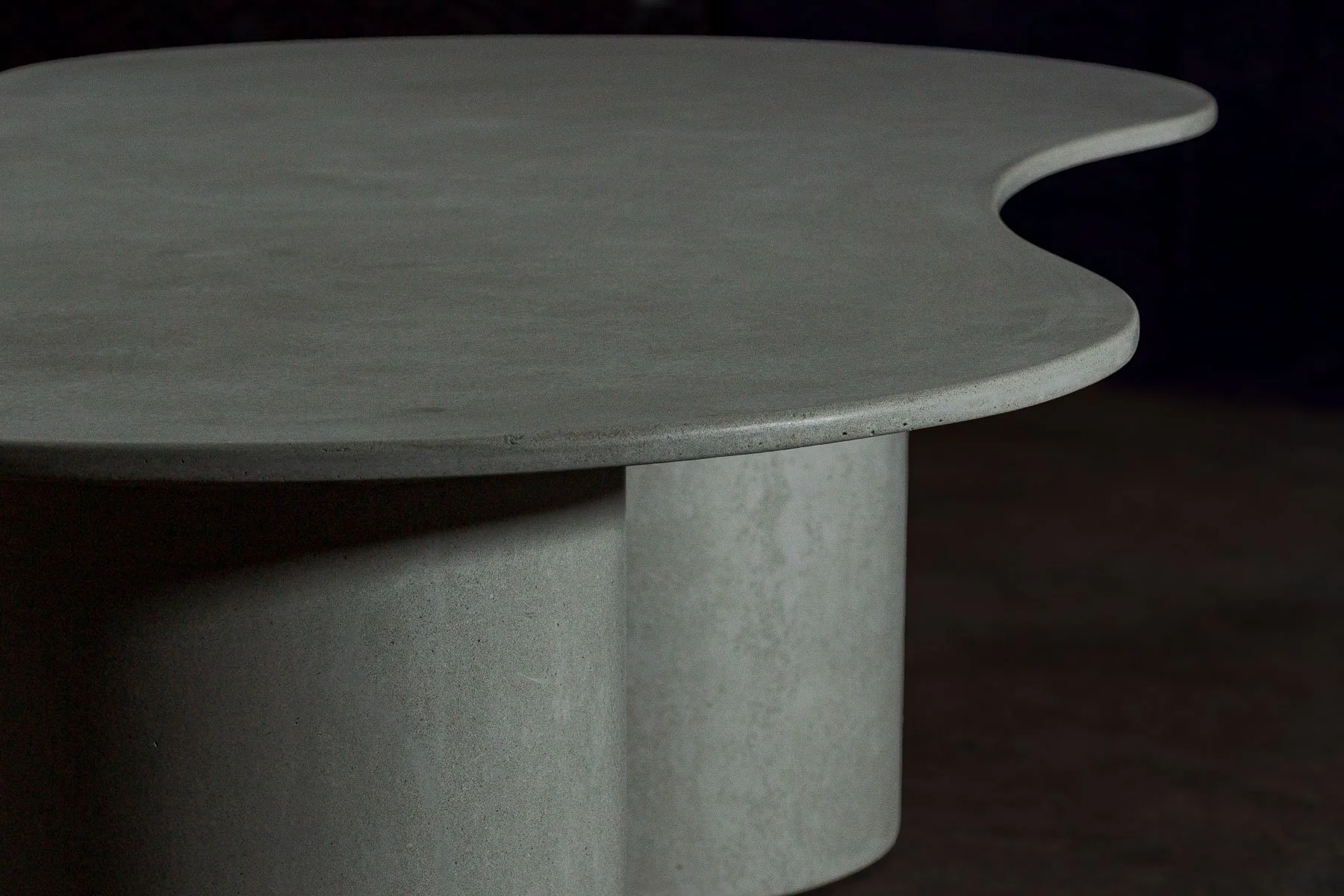 A close study of the suspended edge transition within OVALATION ONE, emphasizing structural tension, curvature, and restrained monolithic presence.
