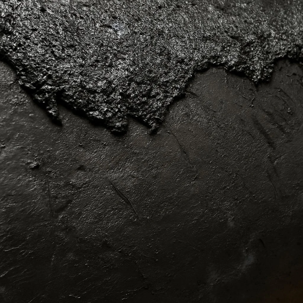 Close-up sculptural concrete texture showing layered mineral-like surface variation and shadowed material fragmentation by The Concrete Anomaly.