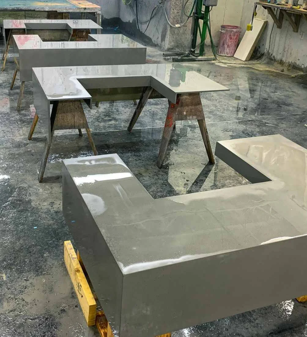 Monolithic architectural concrete counter systems with integrated returns fabricated as continuous single-cast elements in the workshop by The Concrete Anomaly
