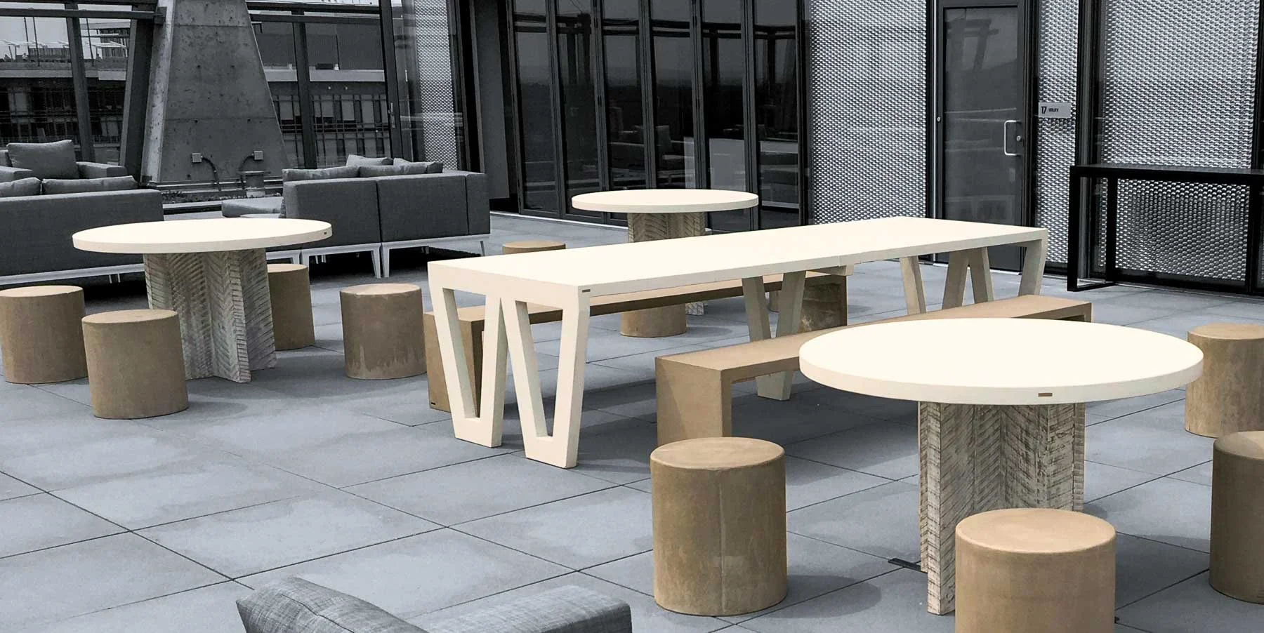 Completed custom concrete table and seating installation on the rooftop terrace at Reston Station.