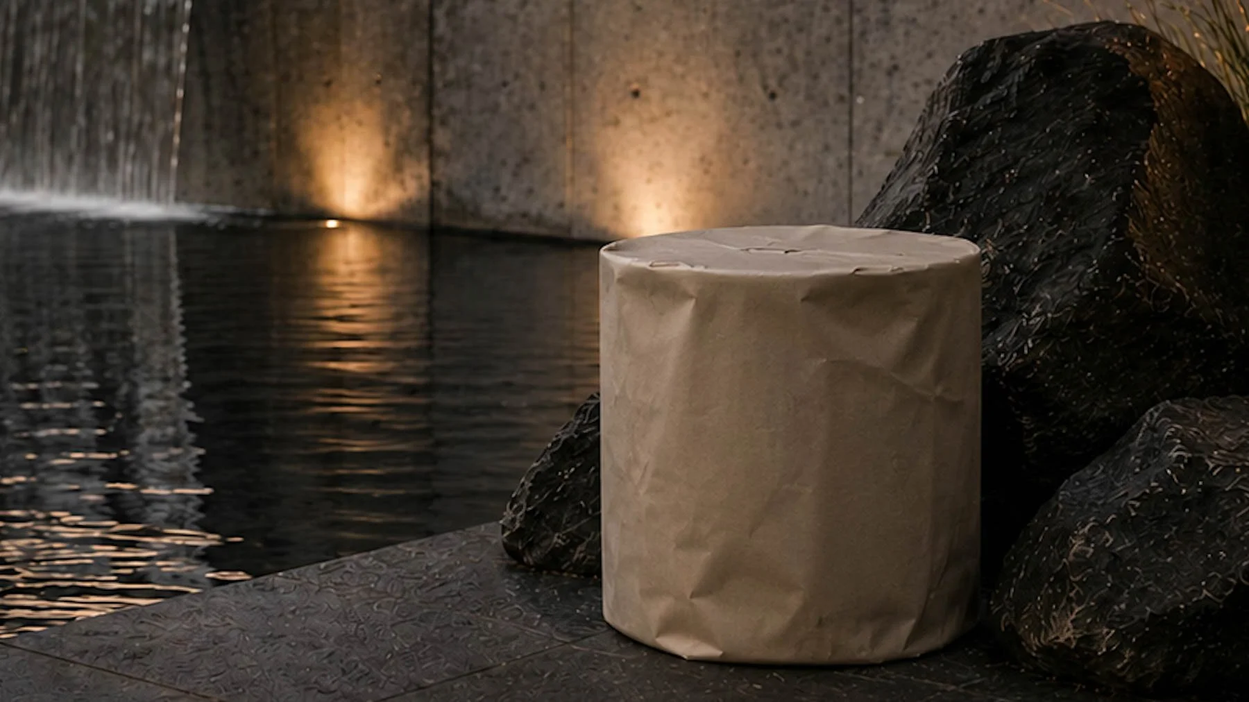 Paper-wrapped cylindrical concrete table displayed in a contemporary interior, illustrating The Concrete Anomaly’s SHIFT concept and the transition between concept and finished condition.