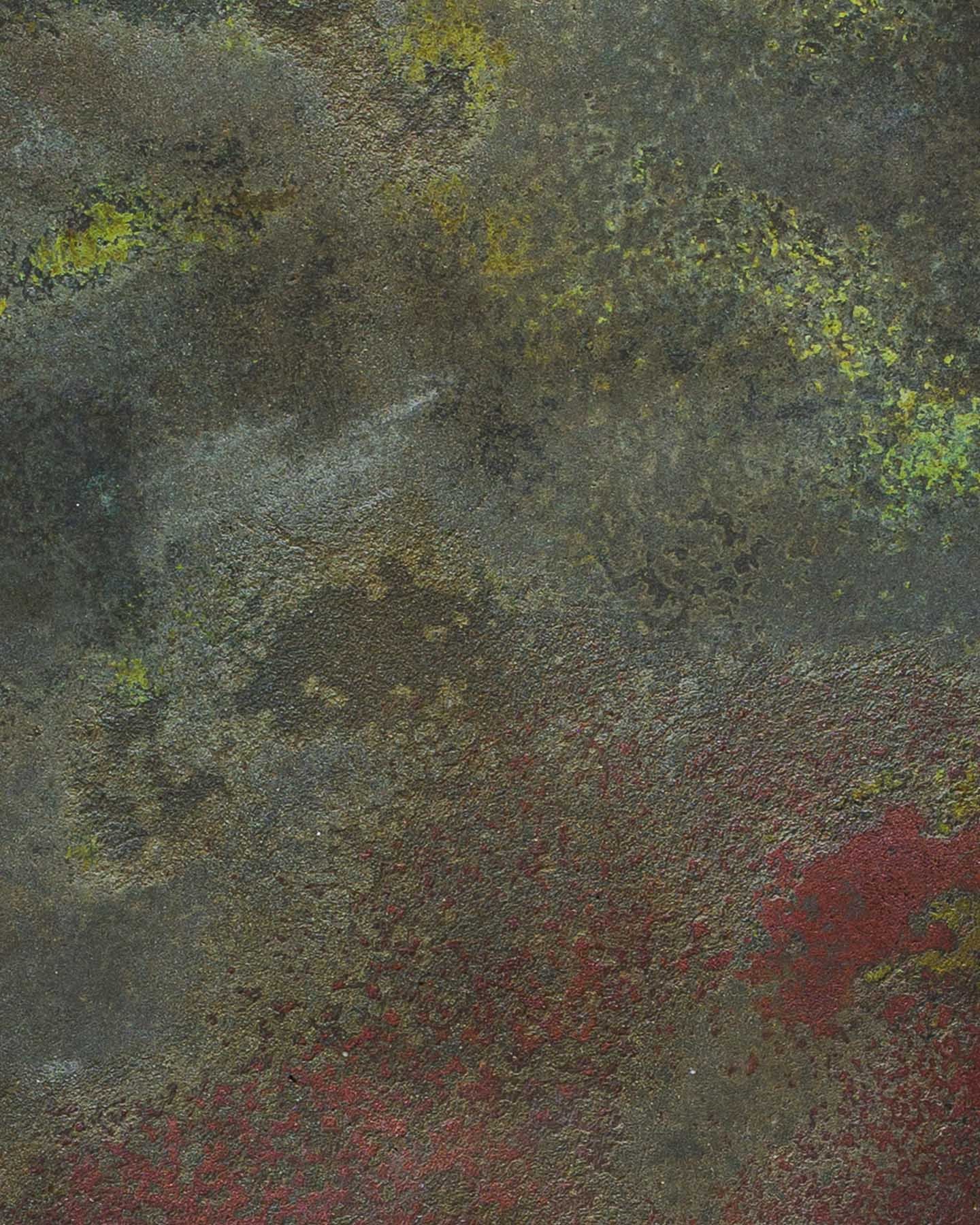 Mineral-rich concrete artifact surface with oxidized texture, layered red pigment, and atmospheric depth