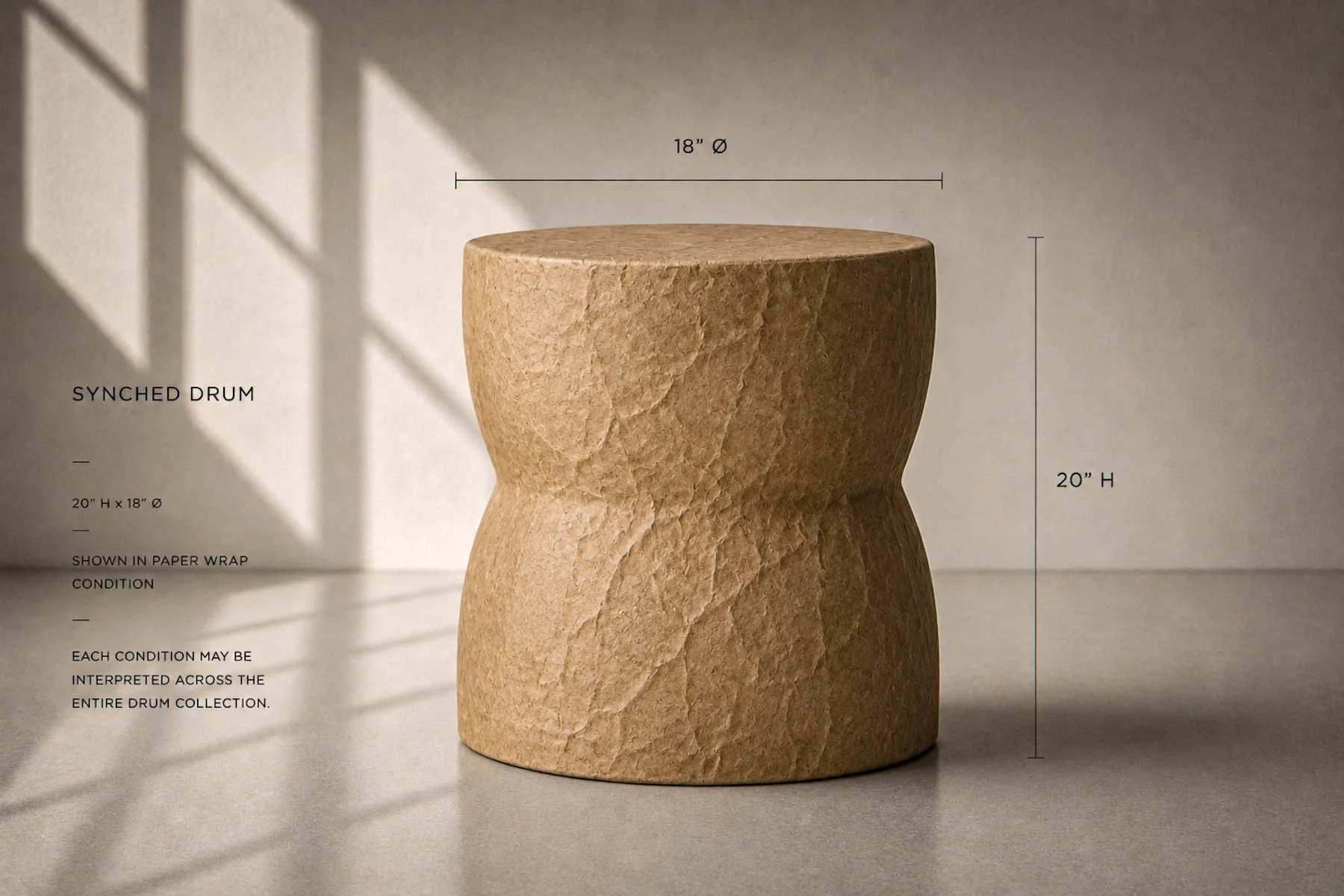Paper-wrapped synched concrete drum side table shown in kraft paper condition with architectural dimension annotations in studio setting.