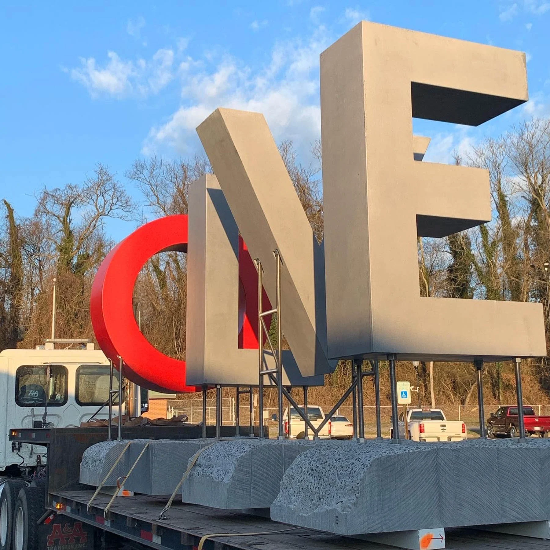 Monumental concrete LOVE sculpture secured on a flatbed truck for transport from The Concrete Anomaly’s Maryland studio.