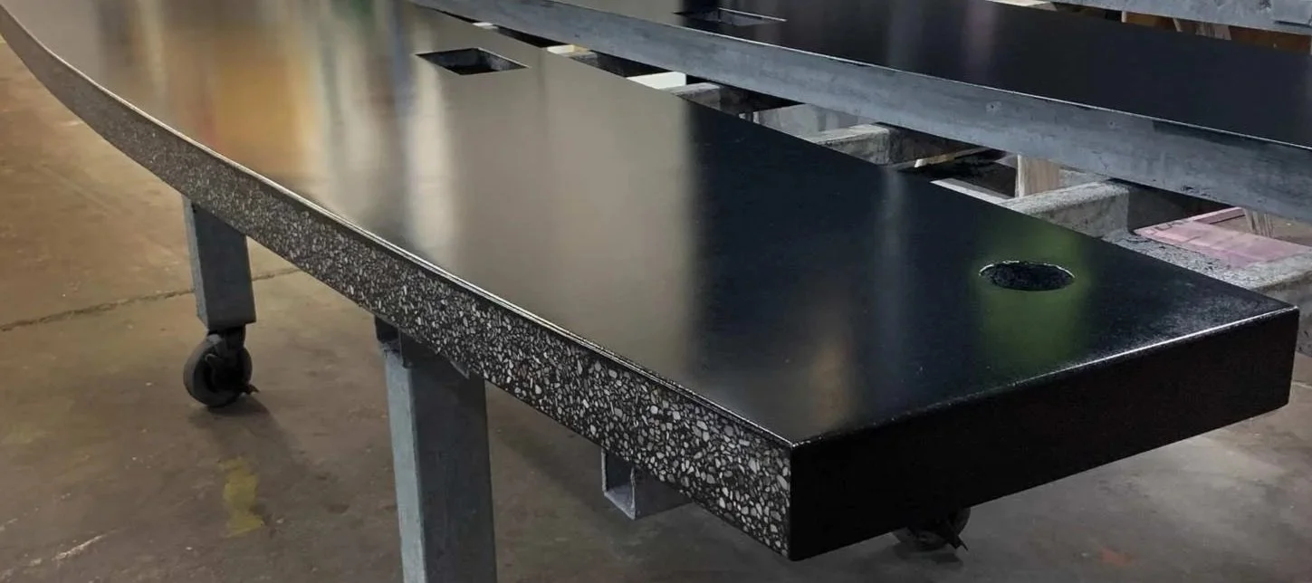 Integrated architectural concrete bar system with exposed aggregate edge detail fabricated for Centro Apartments in Arlington, Virginia.