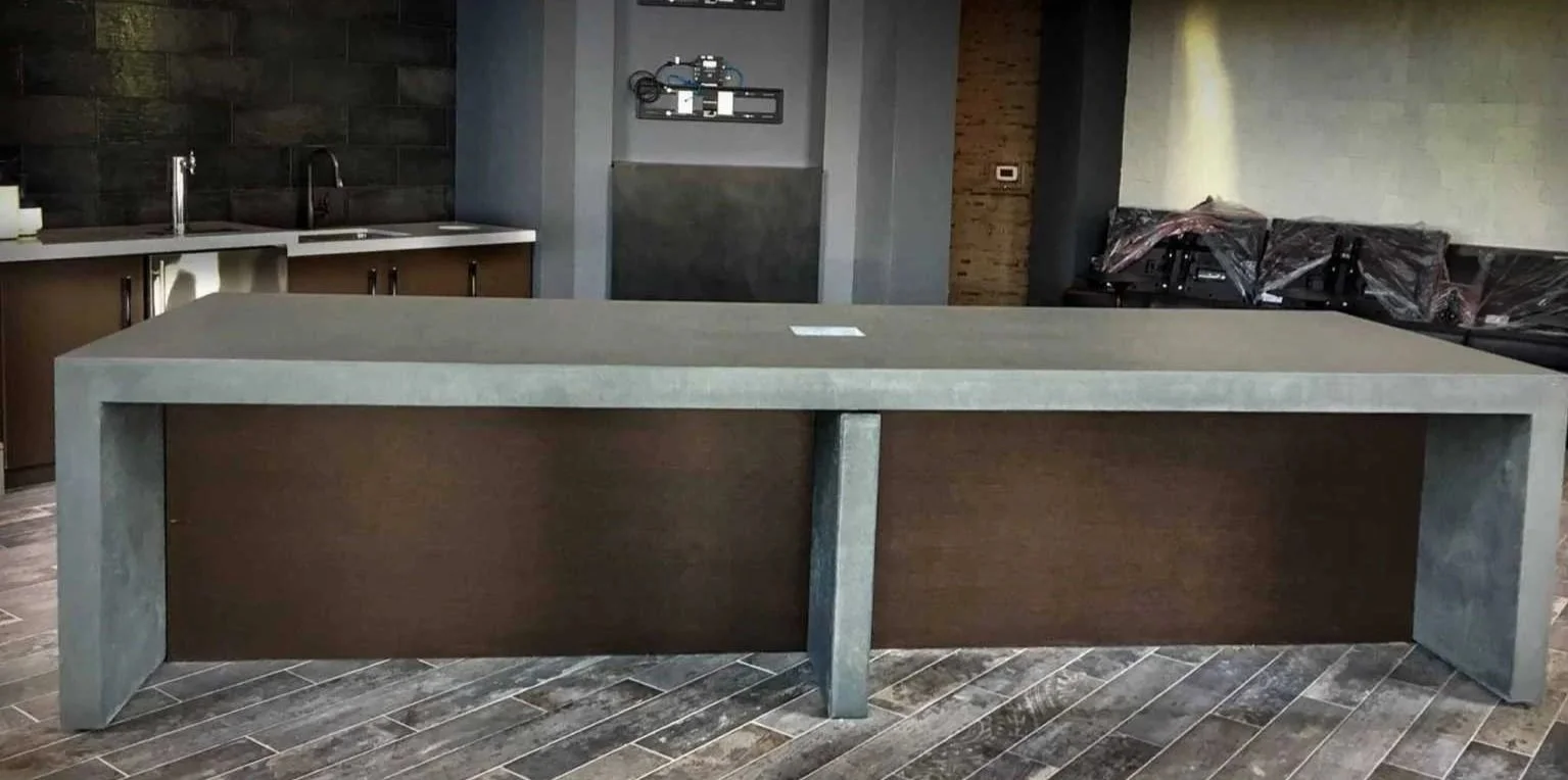 Monolithic architectural concrete island with double waterfall returns fabricated by The Concrete Anomaly for a hospitality interior in Washington, D.C.