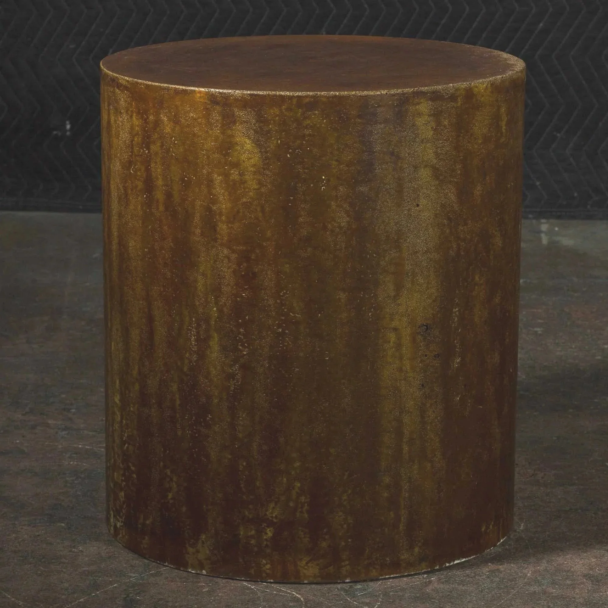 Hand-cast GFRC concrete cylinder featuring weathered bronze and rust-toned acid finish with refined industrial texture from The Concrete Anomaly.