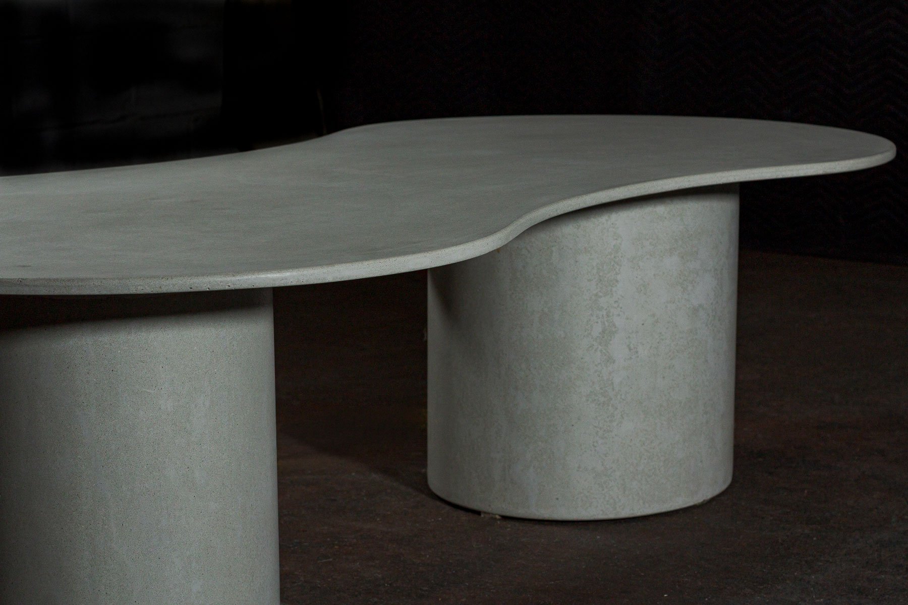 The recessed curvature of OVALATION ONE compresses inward before expanding back into the larger surface plane, creating a quiet sense of movement across the form.