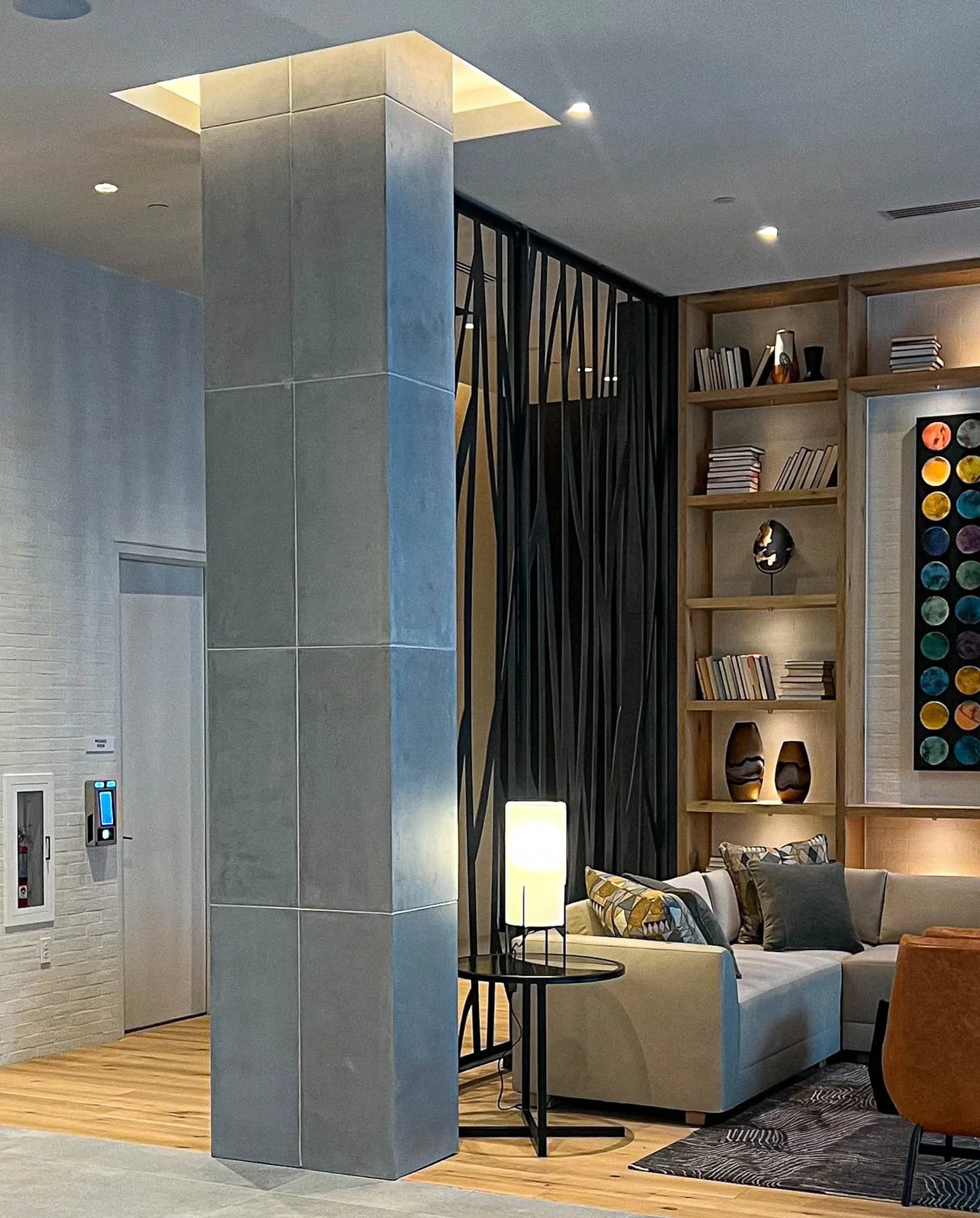 Installed architectural concrete column wrap inside a luxury residential interior.