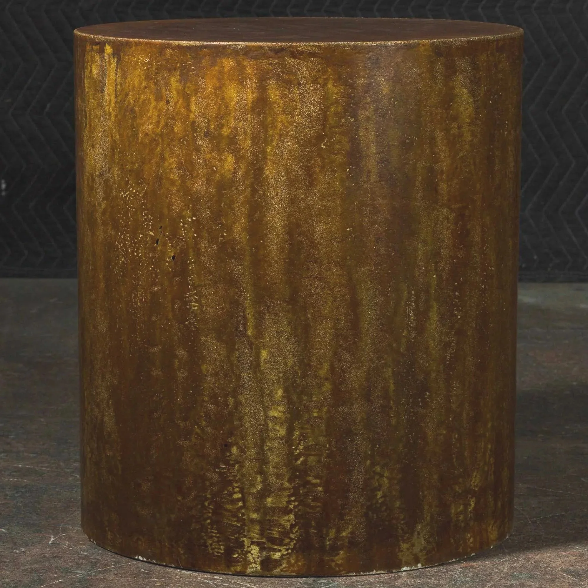 Oxidized steel inspired concrete side table from Line ZERO 023B with layered metallic patina and cylindrical sculptural form by Dylan Myers.