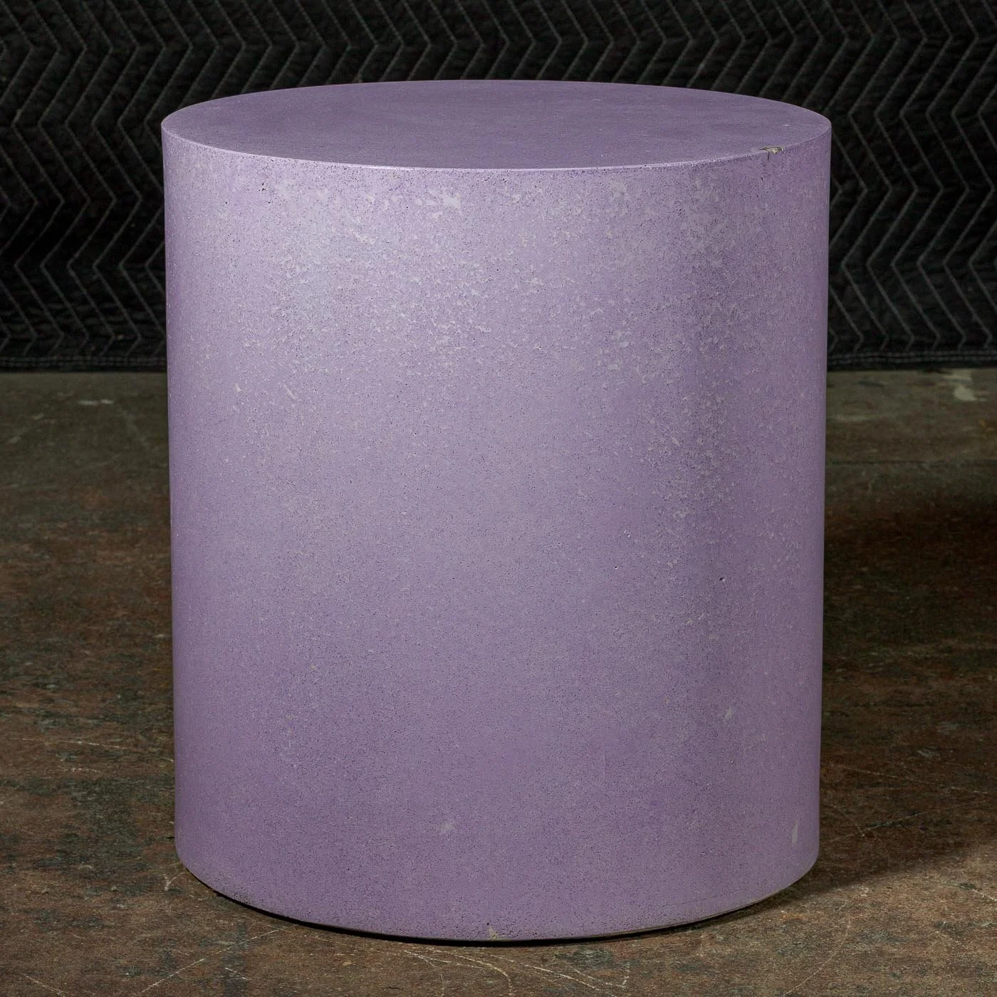 Hand-cast GFRC concrete cylinder featuring soft violet mineral tones and refined monolithic surface texture.
