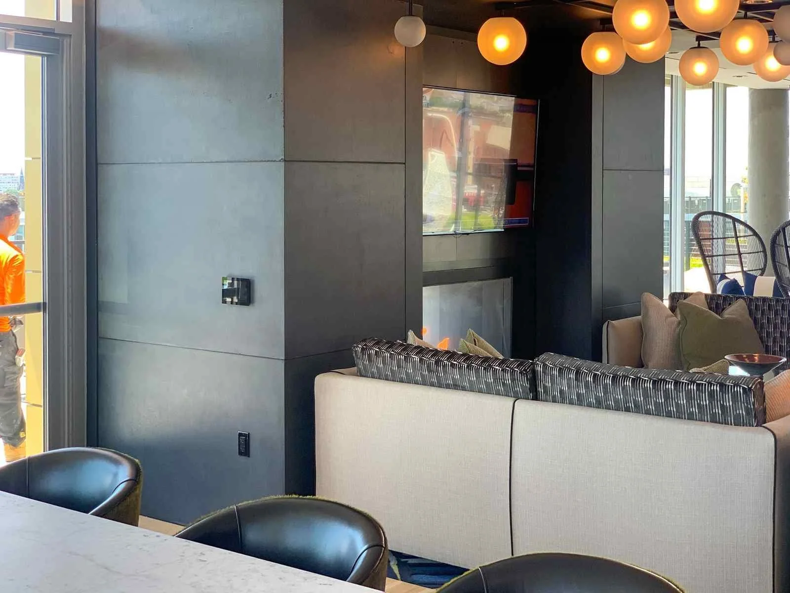 Custom cast concrete wall and counter elements integrated within a modern lounge or restaurant interior.