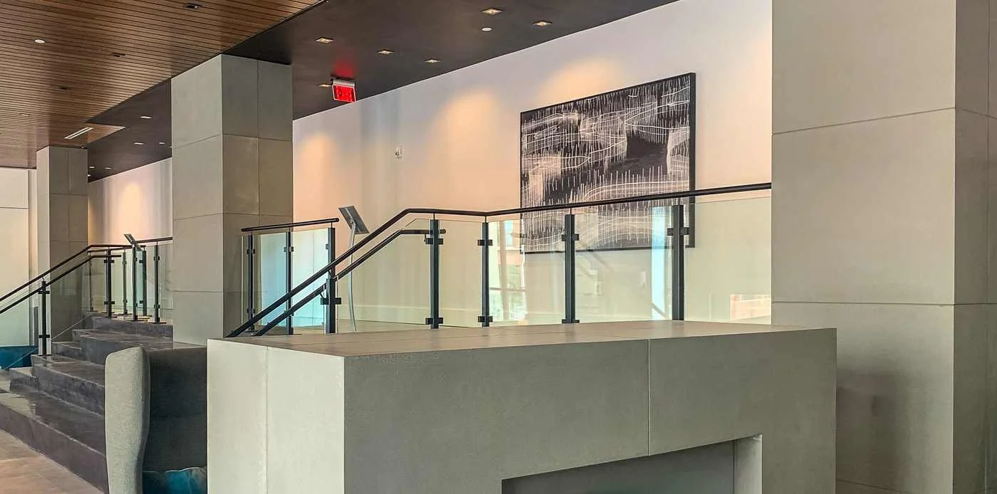 Custom cast concrete wall and column wraps integrated within a modern architectural interior.