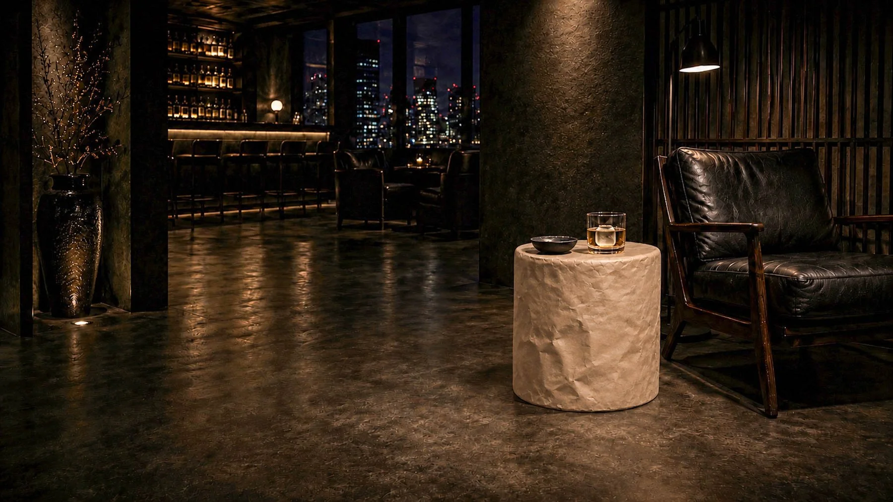 Paper-wrapped cylindrical form positioned beside a leather lounge chair within a dimly lit contemporary nightclub interior. action:wrapped