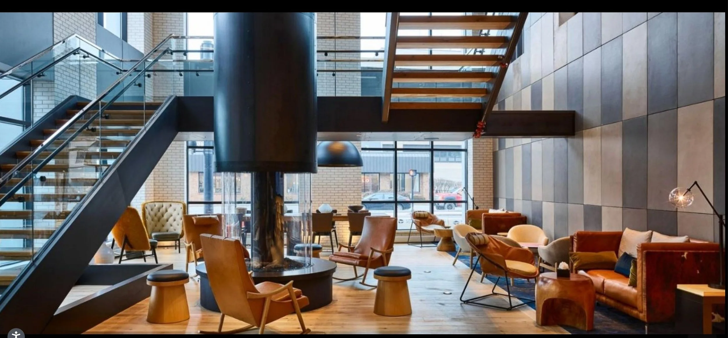 Custom cast concrete wall panels forming a central architectural backdrop within a modern lounge.