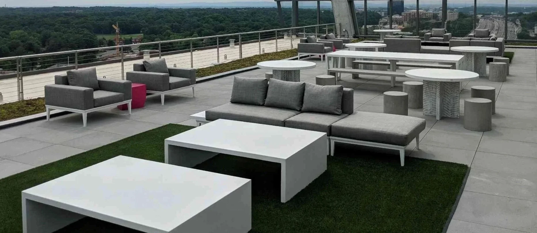 Architectural concrete furnishings and integrated outdoor seating systems by The Concrete Anomaly installed at the rooftop terrace of 1900 Reston Metro Plaza designed by Jahn.