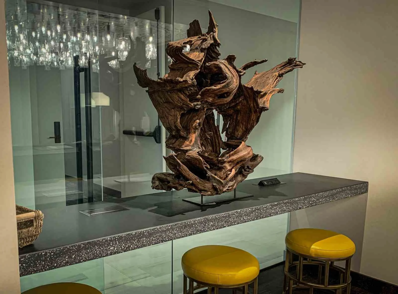 Custom architectural concrete display base and countertop fabricated by The Concrete Anomaly, supporting a sculptural installation in a commercial interior.