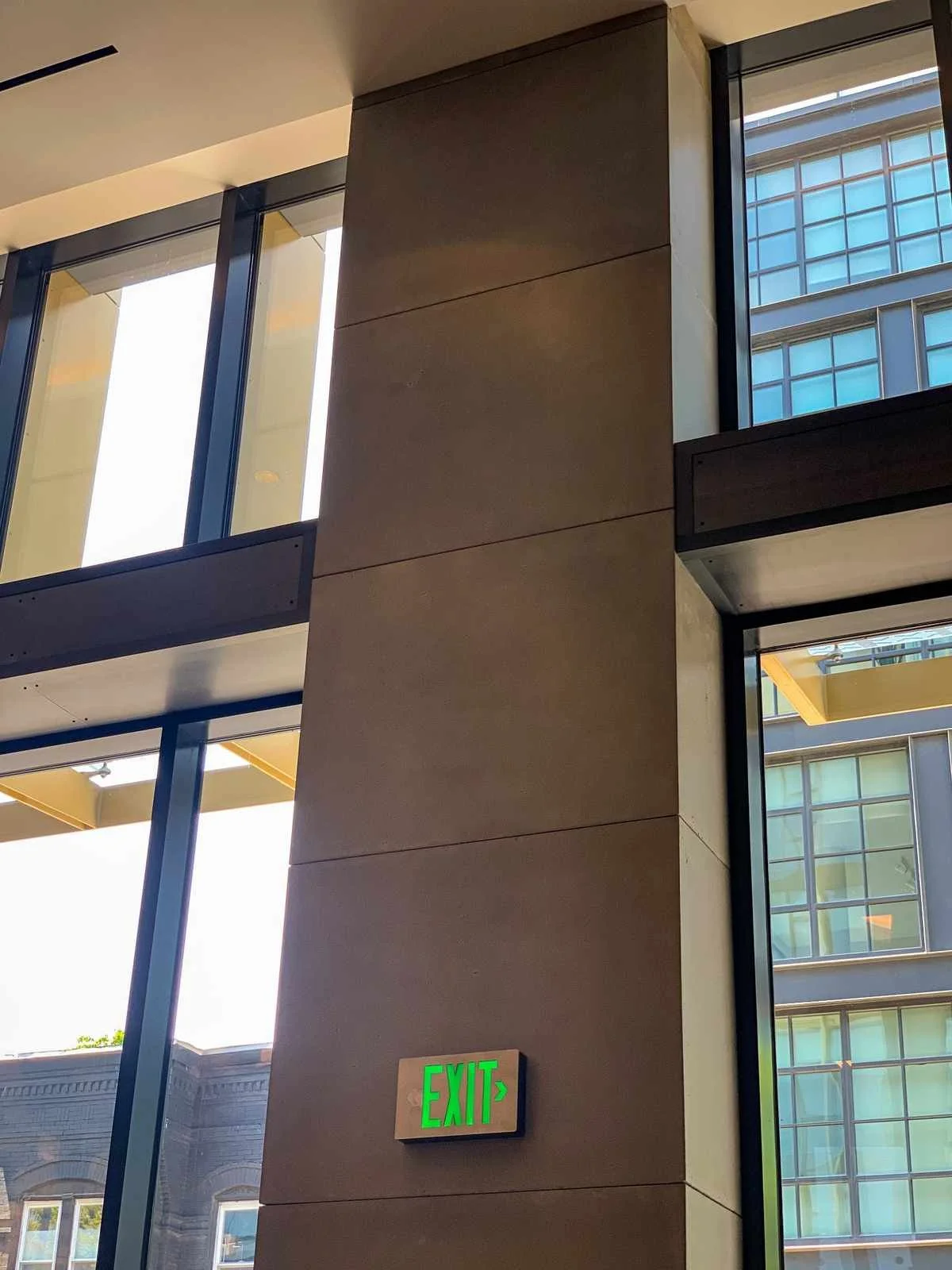 Custom cast concrete column wrap installed as an architectural feature within a modern commercial interior.