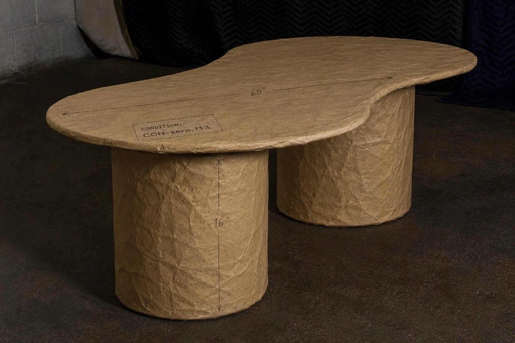 Paper Wrapped OVALATION ONE coffee table showing condition mapping and hand-sketched dimensions applied directly to the paper wrapped form. action:wrapped