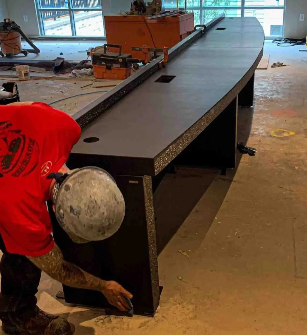 Sectional monolithic concrete bar system installation at Centro Apartments in Arlington, Virginia with integrated waterfall returns and minimal field assembly.