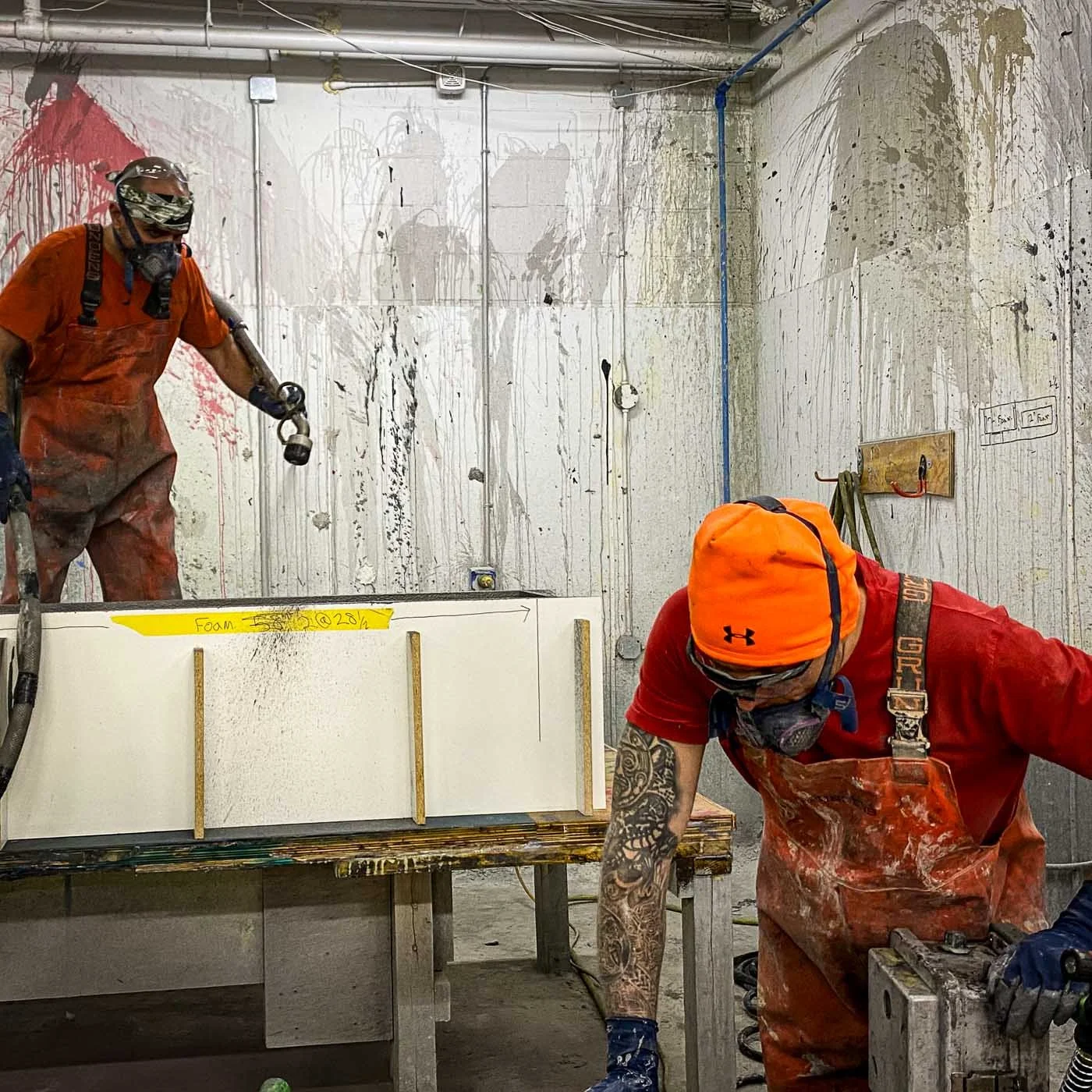 Studio artisans assembling foam formwork used to cast components of the concrete LOVE sculpture.