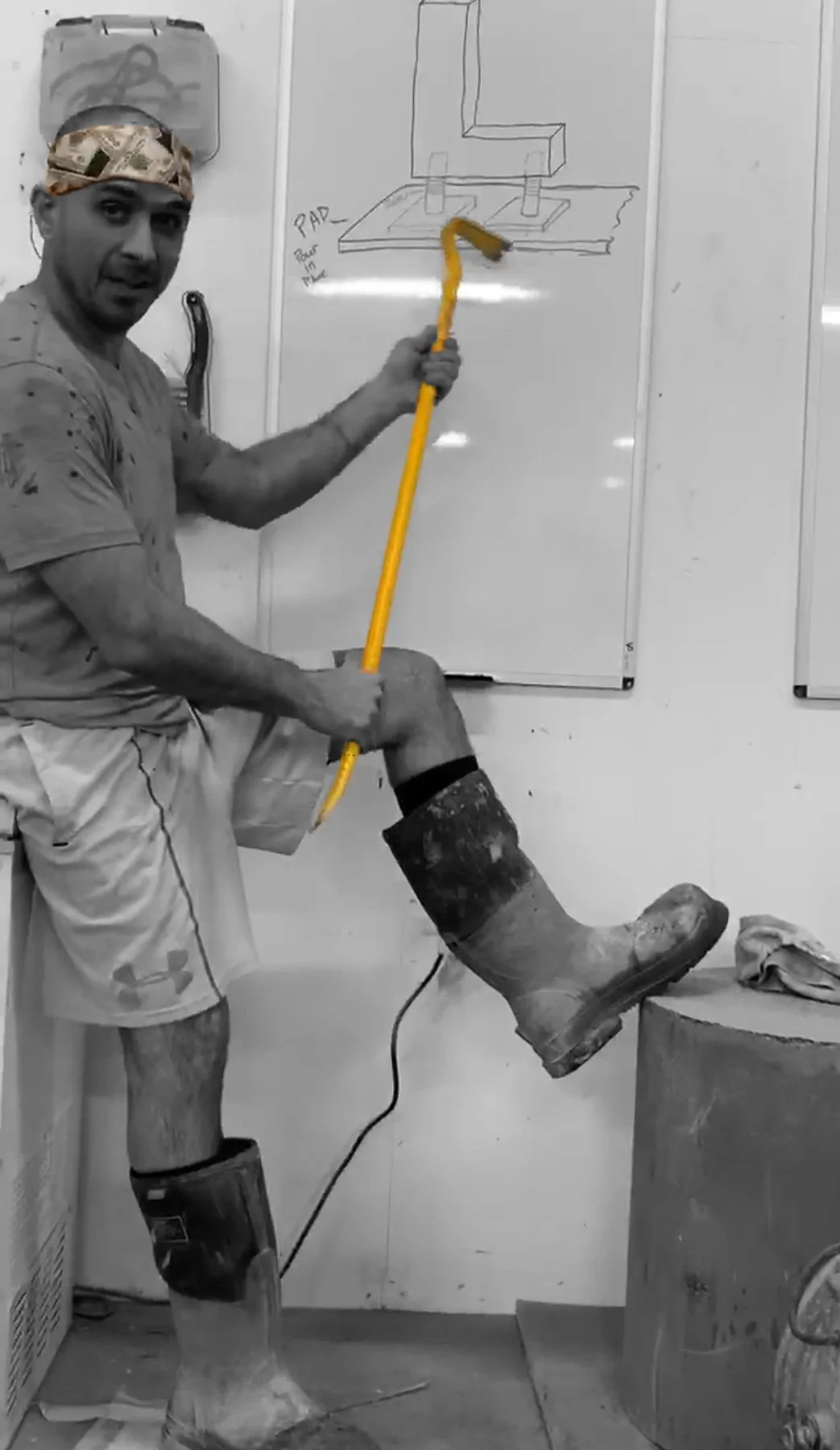 The Concrete Anomaly artist beside a technical installation drawing during the development of a large-scale concrete work.