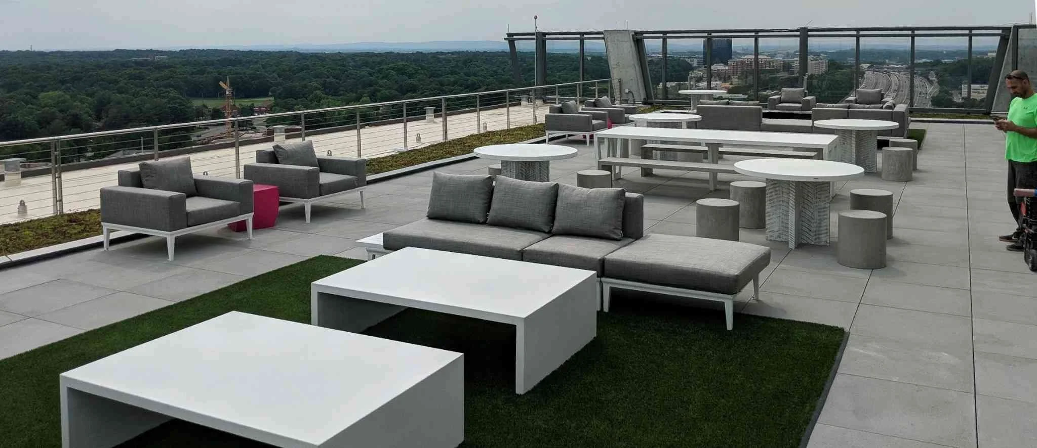 Custom precast concrete exterior furniture installed on a commercial rooftop terrace, designed for durability and modern urban use.