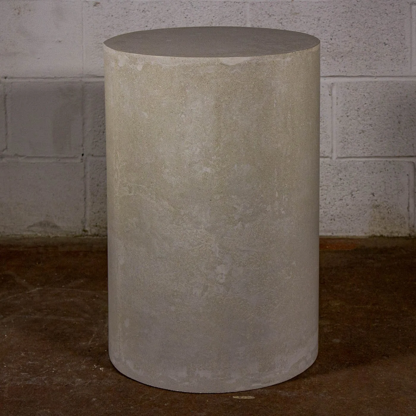 Monolithic white concrete side table from LINE ZERO featuring subtle tonal variation and quiet atmospheric surface movement