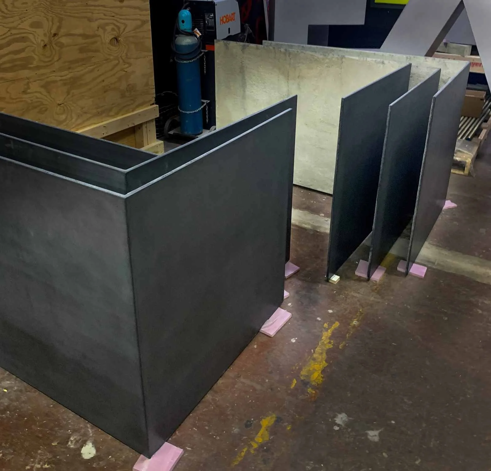 Cast concrete panel elements staged in the workshop during fabrication and finishing.